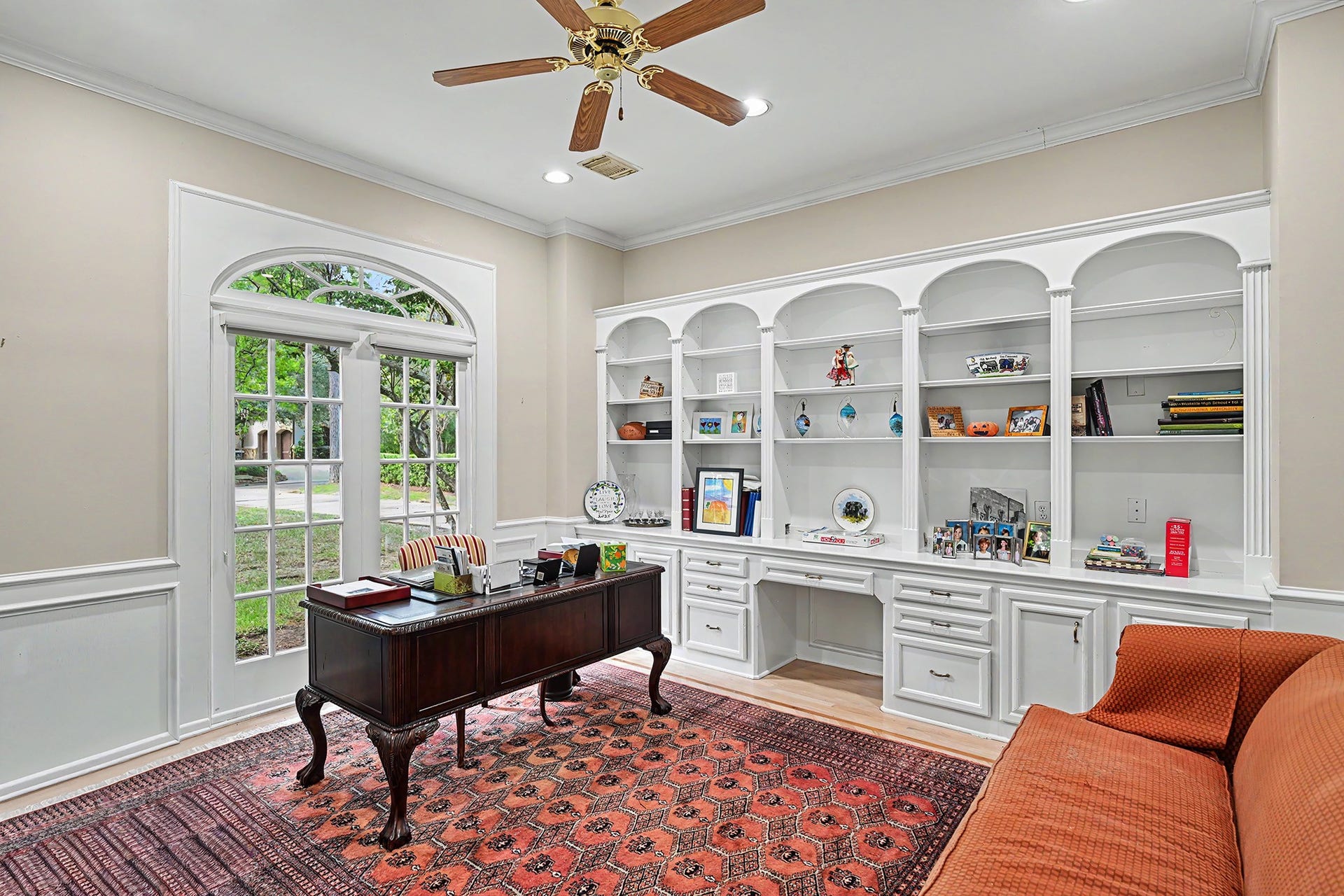 10 Sandalwood Drive, Houston, TX 77024 The study or library off the entry has a lovely view of the front yard and features a wall of built in shelves and cabinets. French doors provide privacy ans space to focus and work or read.