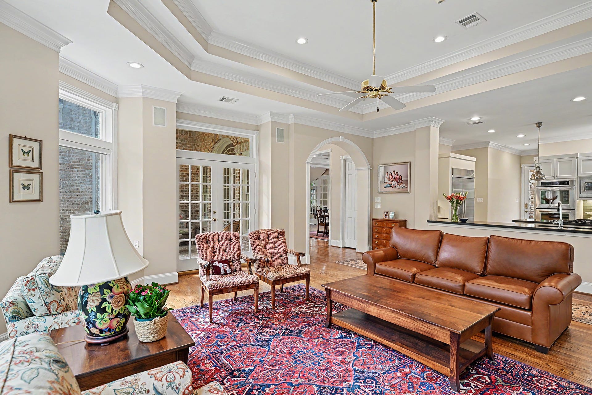 10 Sandalwood Drive, Houston, TX 77024 Through the french doors is the covered patio, side yard, and wooded lakefront.