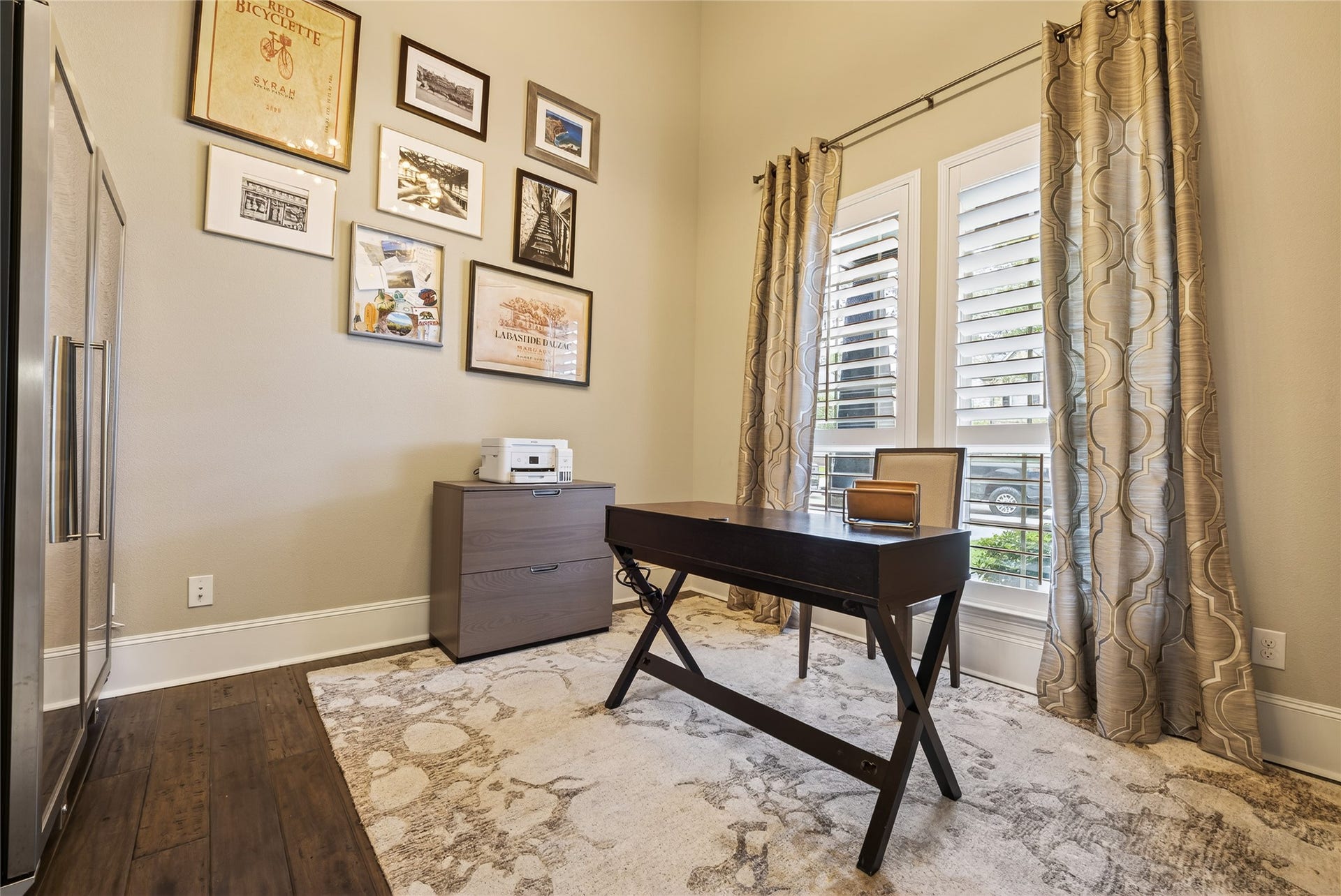 Generous sized dedicated home office in the front of the home.  Gleaming engineered wood floors and large windows.