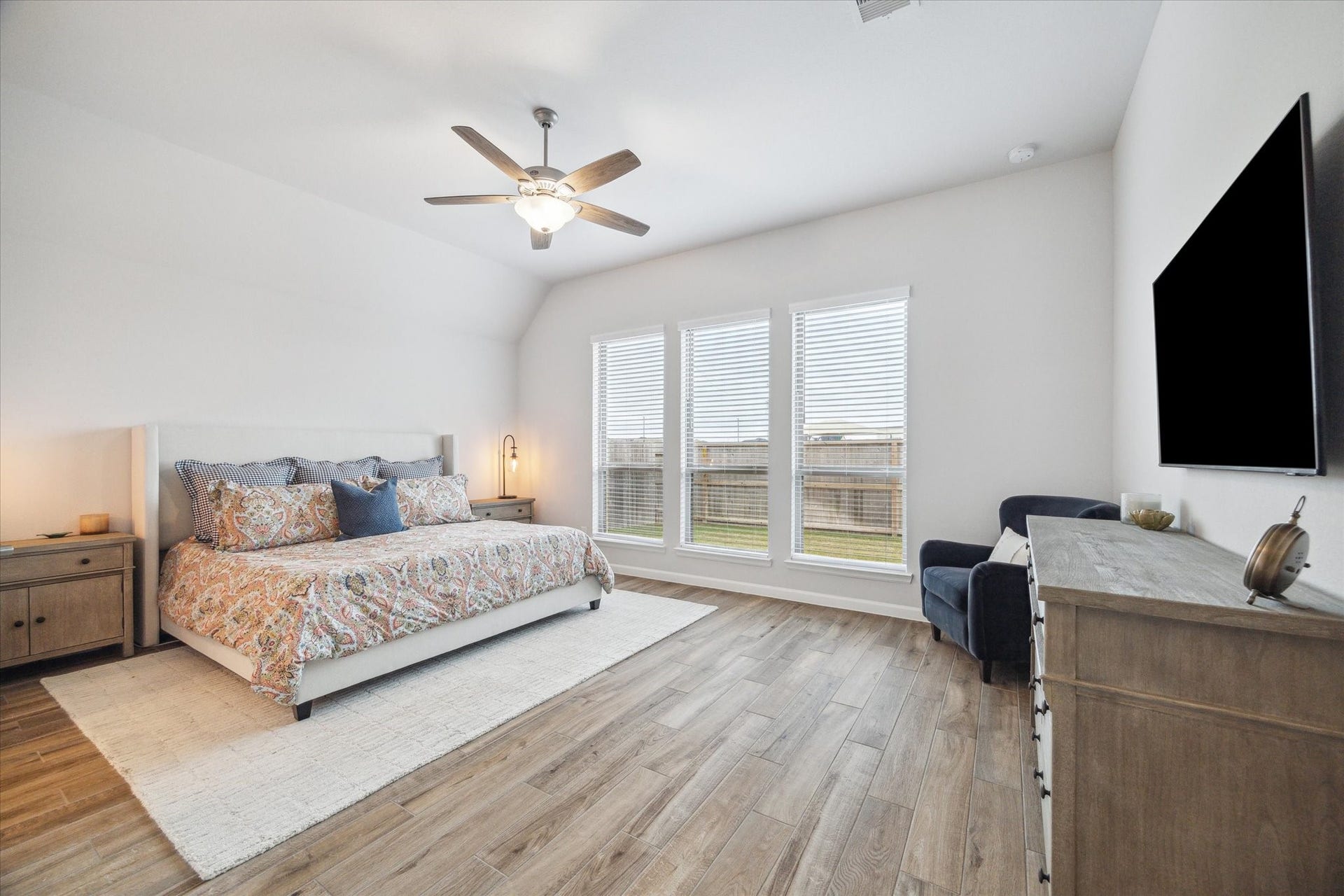 1523 Carson Field Lane, Richmond, TX 77469 Primary Bedroom is large enough to accommodate grand furniture, features three large windows, high ceilings & TWO walk in closets.