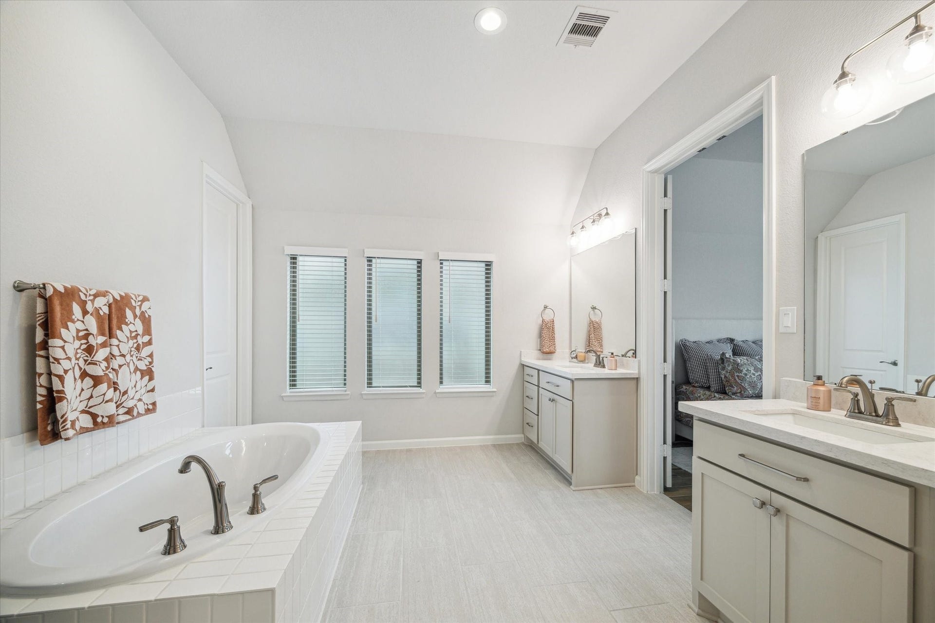 1523 Carson Field Lane, Richmond, TX 77469 The Primary Bath features separate vanities, a stand up shower, a soaking tub & TWO walk in closets.