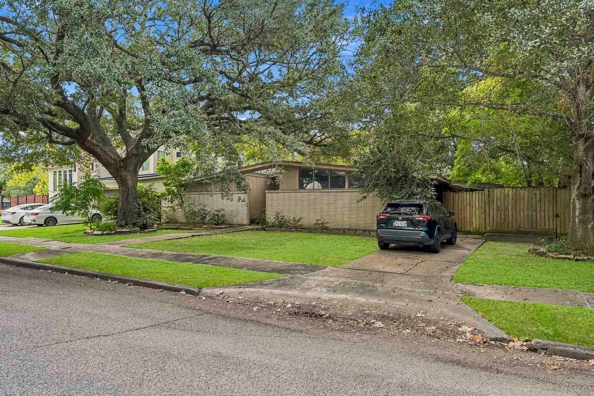 5107 Jackwood Street, Houston, TX 77096 Street-level view of the existing improvements, with the property offered at lot value.