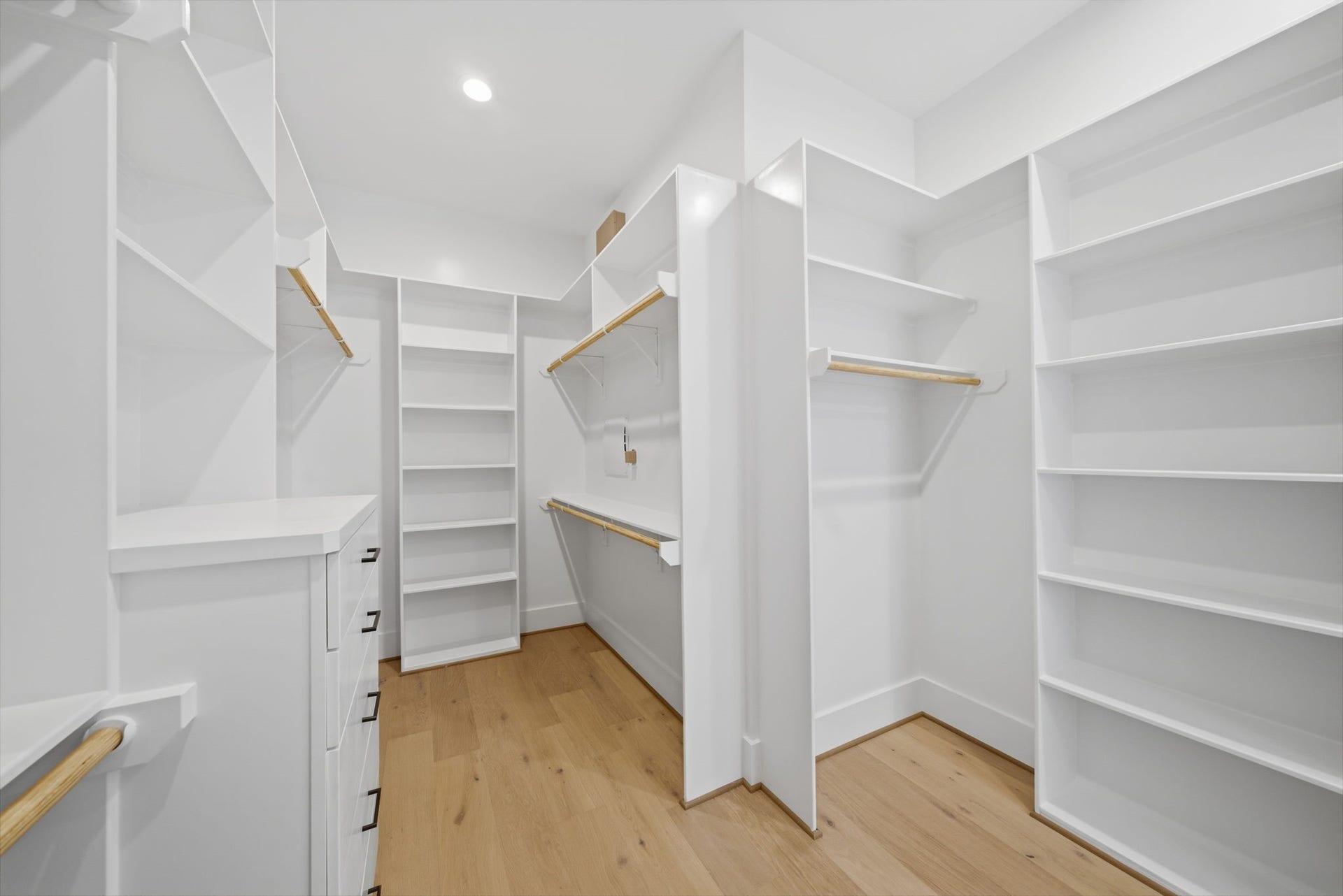 1322 Lawrence Street, Houston, TX 77008 Alternate view HUGE walk-in closet with built-ins and plenty of space to keep organized. This is one of two master closets. (Photos are of a previously completed home. Finishes are subject to change.)