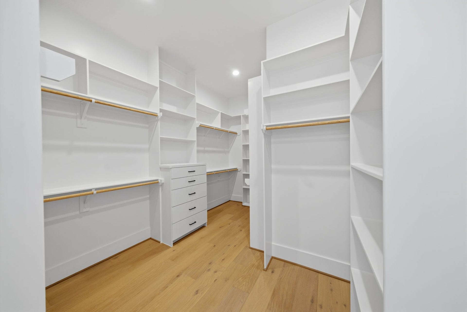 1322 Lawrence Street, Houston, TX 77008 HUGE walk-in closet with built-ins and plenty of space to keep organized. This is one of two master closets. (Photos are of a previously completed home. Finishes are subject to change.)