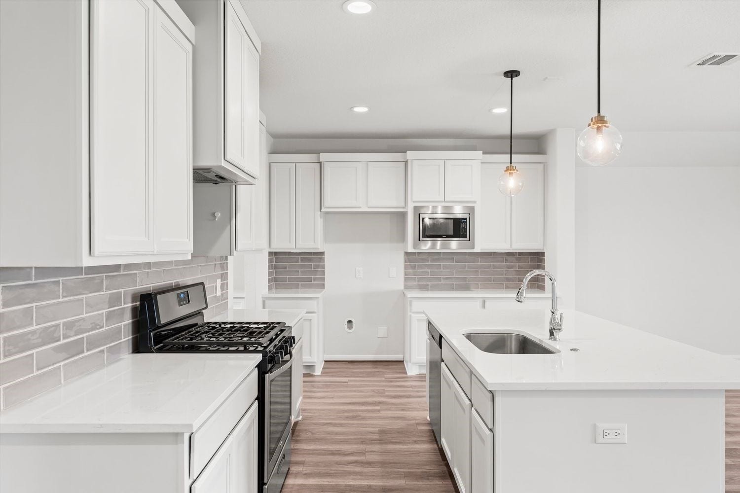2125 Rope Maker Drive, Conroe, TX 77384 Chef's kitchen with large kitchen island and stainless steel appliances.