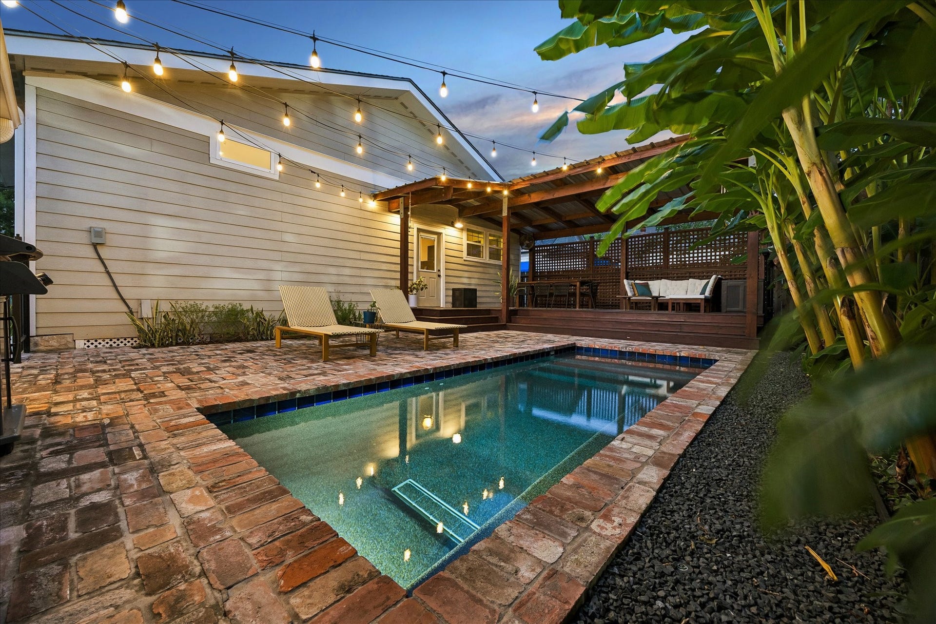 106 Alma Street, Houston, TX 77009 Backyard with a pool and lush landscaping