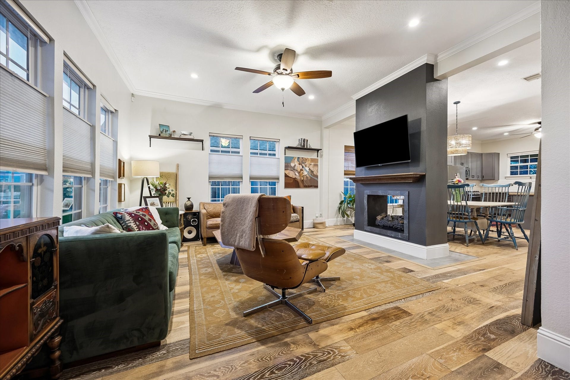 106 Alma Street, Houston, TX 77009 Stunning open concept living room with a double sided fireplace as a focal point