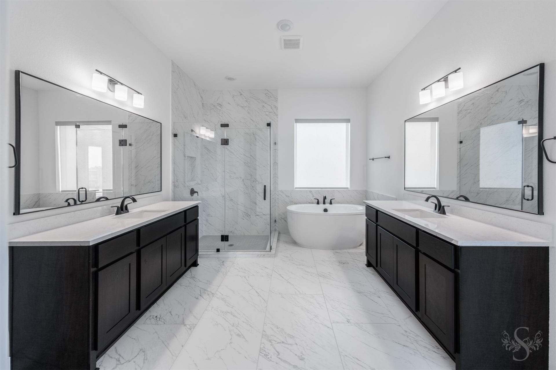 Luxurious primary bath with elegant modern finishes.