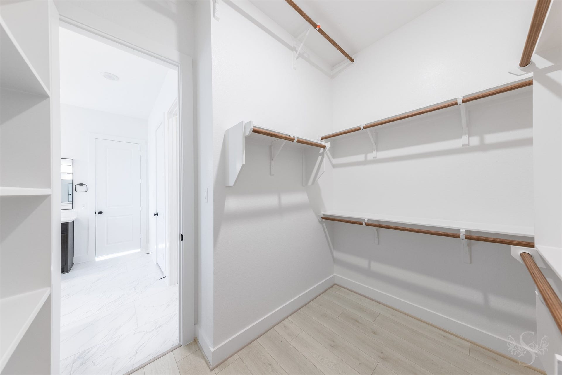 Generous primary walk-in closet.