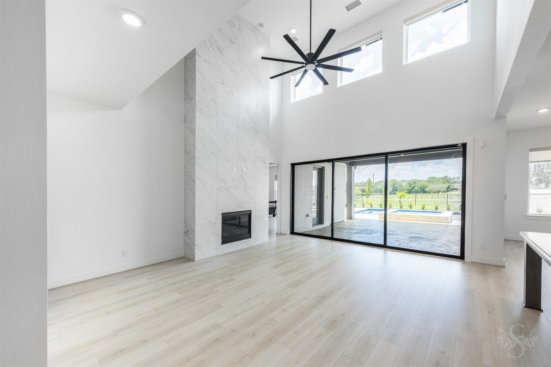 Impressive living area with soaring ceilings and expansive sliding doors.