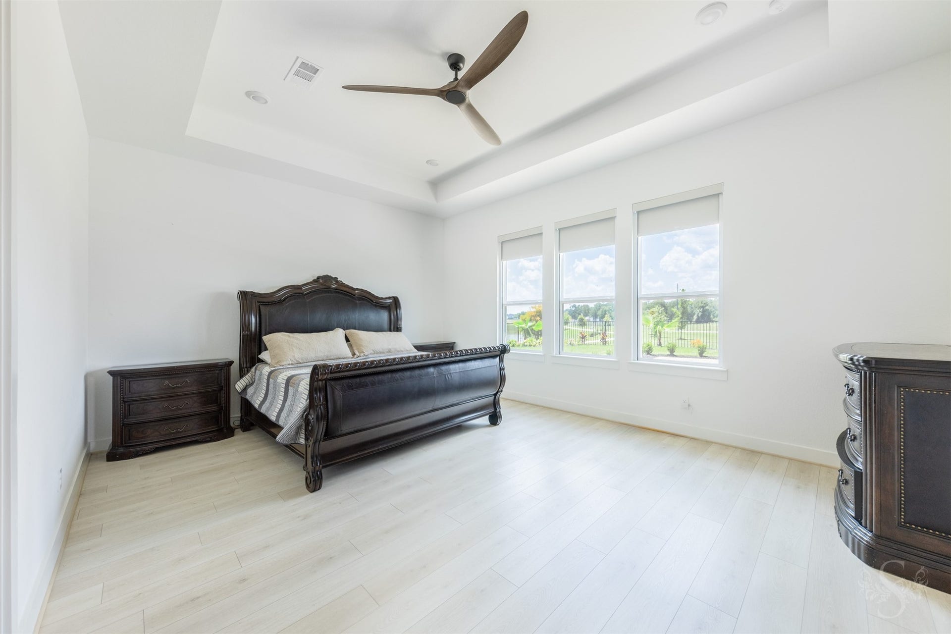 Primary bedroom with abundant natural light.