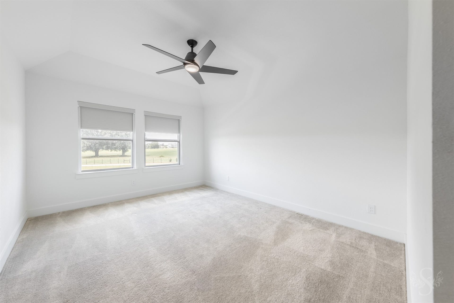Spacious secondary bedroom with natural light.