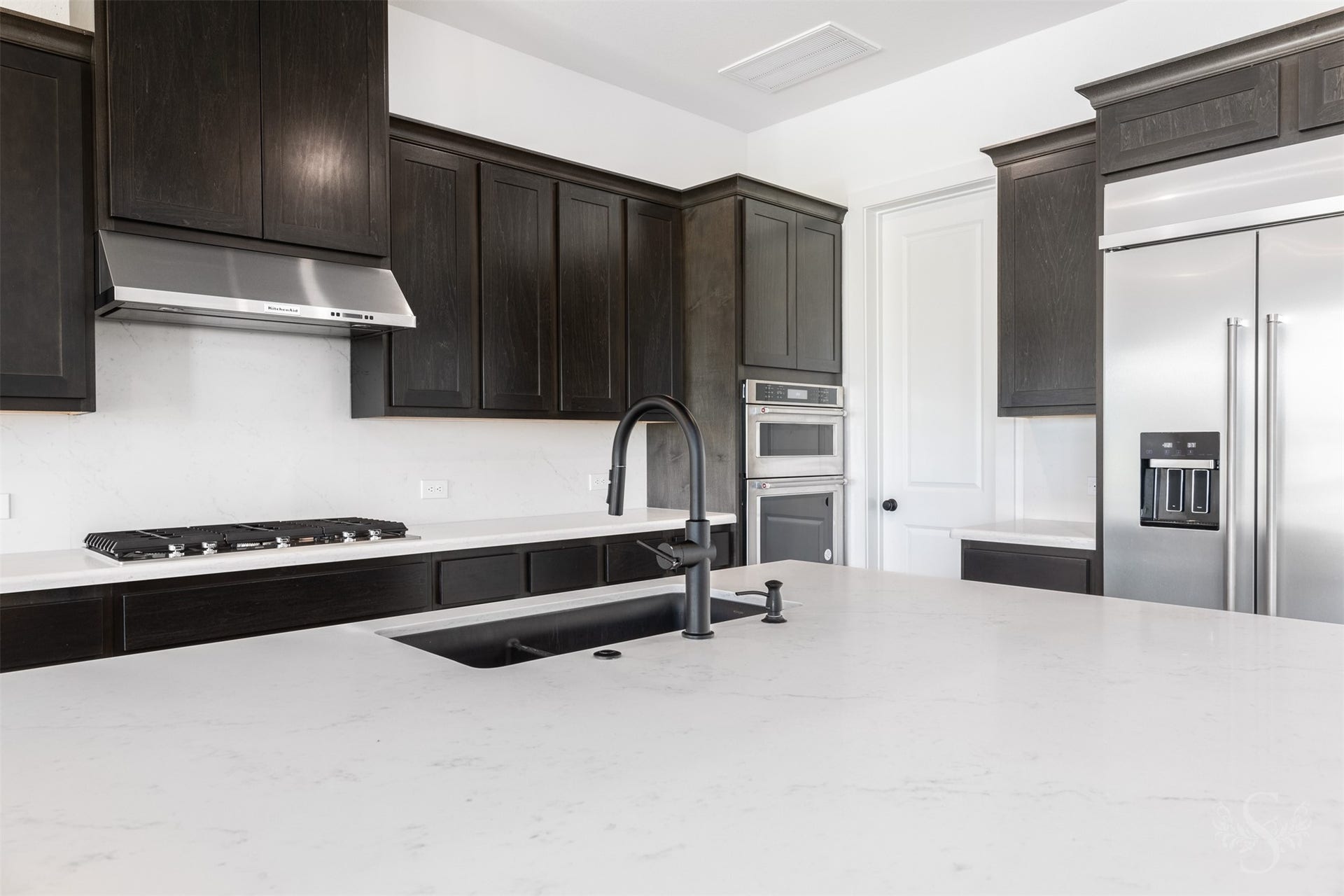 Beautifully appointed kitchen with abundant cabinetry.