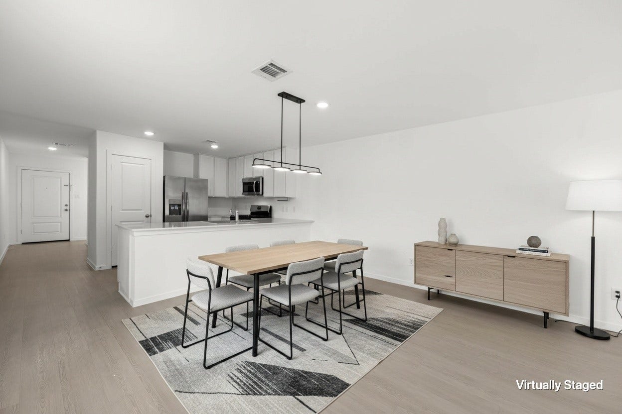 Virtually staged dining space illustrates a generous dining arrangement adjacent to the open kitchen, complemented by contemporary pendant lighting and durable flooring.