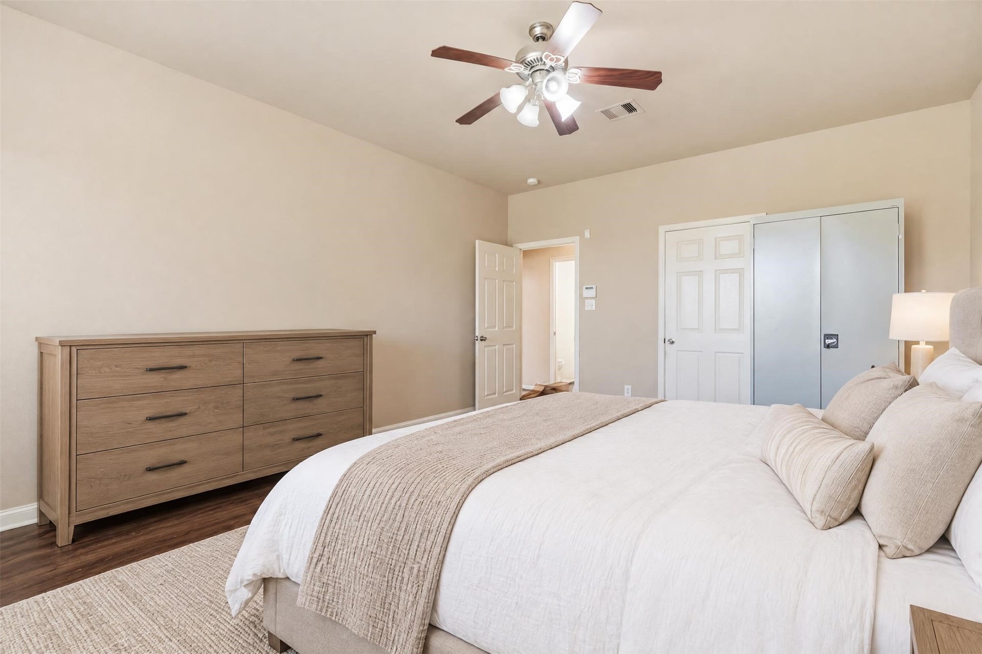 5106 Autumn Rose Lane, Sugar Land, TX 77479 Virtually staged. Another view of the primary suite showing its generous layout and easy access to the ensuite bath and walk-in closet.