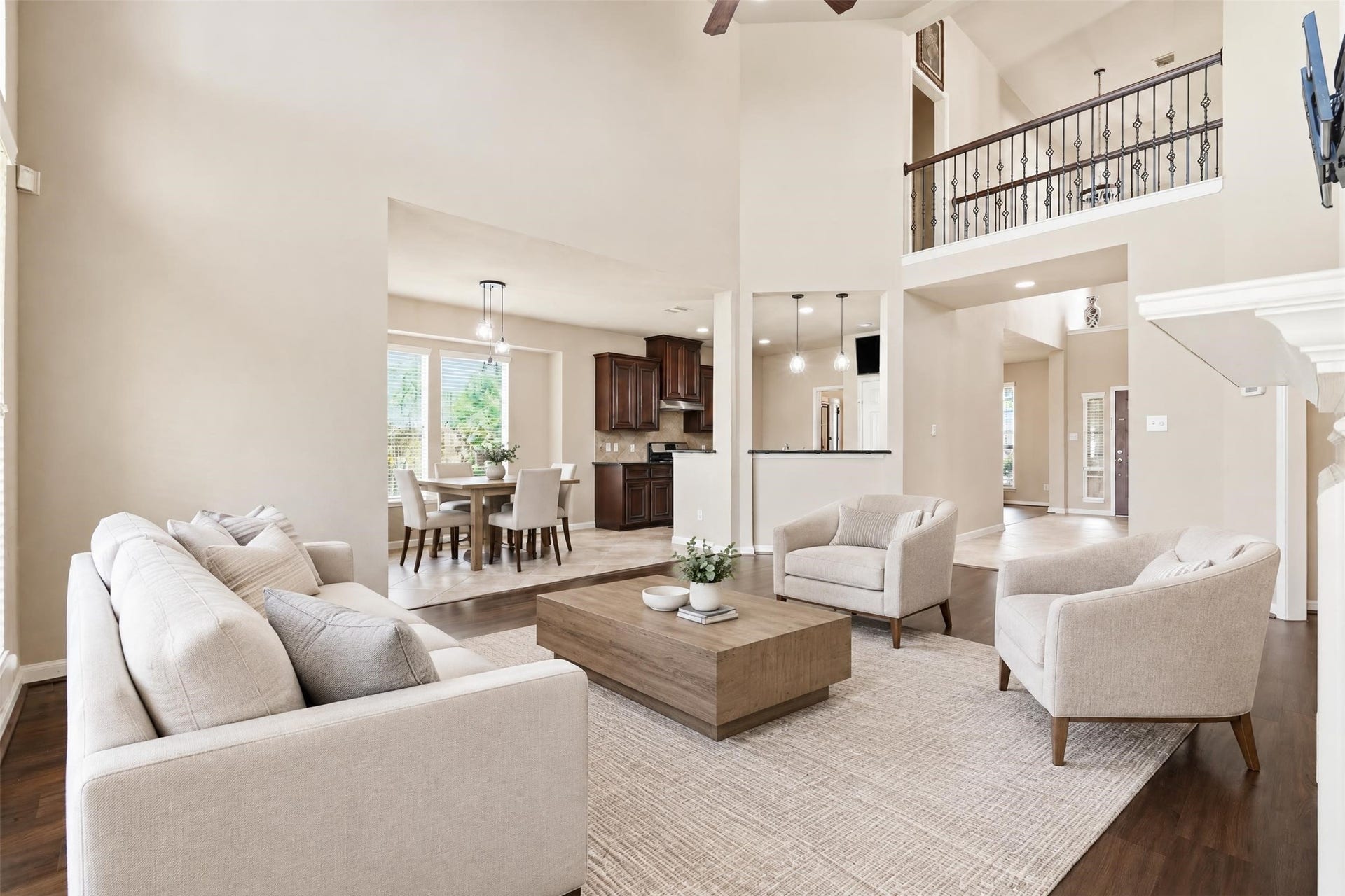 5106 Autumn Rose Lane, Sugar Land, TX 77479 Virtually staged. Soaring ceilings and an upstairs overlook give the home an open, airy feel you notice the moment you walk in.