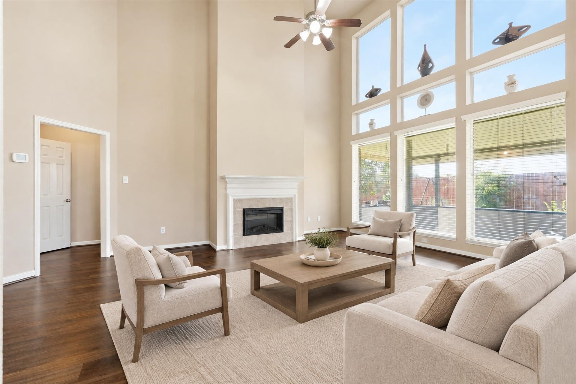 5106 Autumn Rose Lane, Sugar Land, TX 77479 Virtually staged. Easy-care updated flooring and an electric fireplace make this a comfortable everyday gathering spot that also works for entertaining.