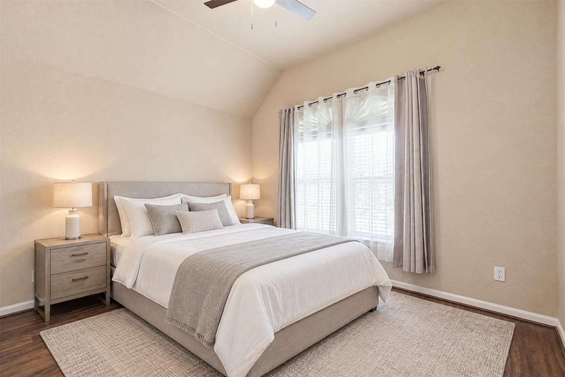 5106 Autumn Rose Lane, Sugar Land, TX 77479 Virtually staged. The third bedroom has a vaulted ceiling and a large window that fills the room with natural light.