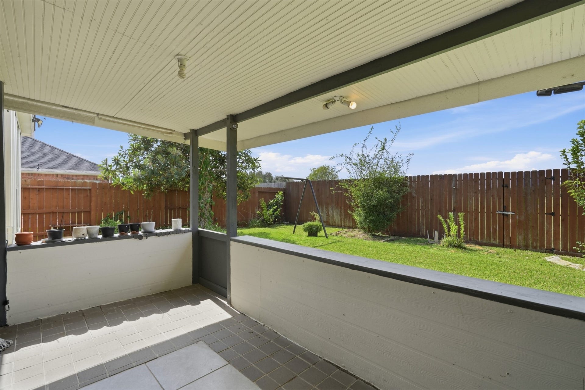 5106 Autumn Rose Lane, Sugar Land, TX 77479 Covered patio, ideal for Houston evenings. Grill out, enjoy the breeze and keep an eye on the yard from the shade.