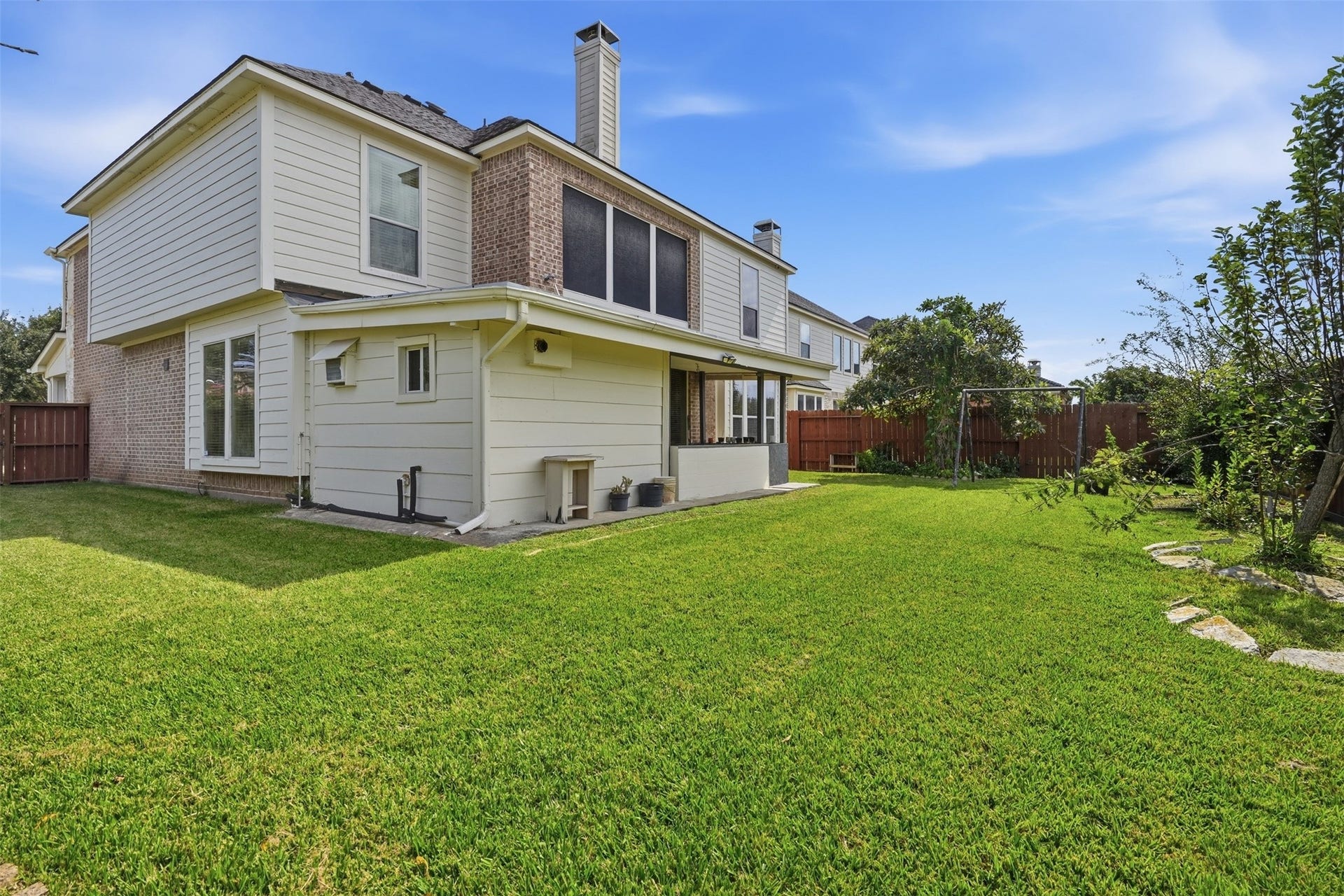 5106 Autumn Rose Lane, Sugar Land, TX 77479 Fully fenced, with open green space beyond, so there are no neighbors directly behind you.