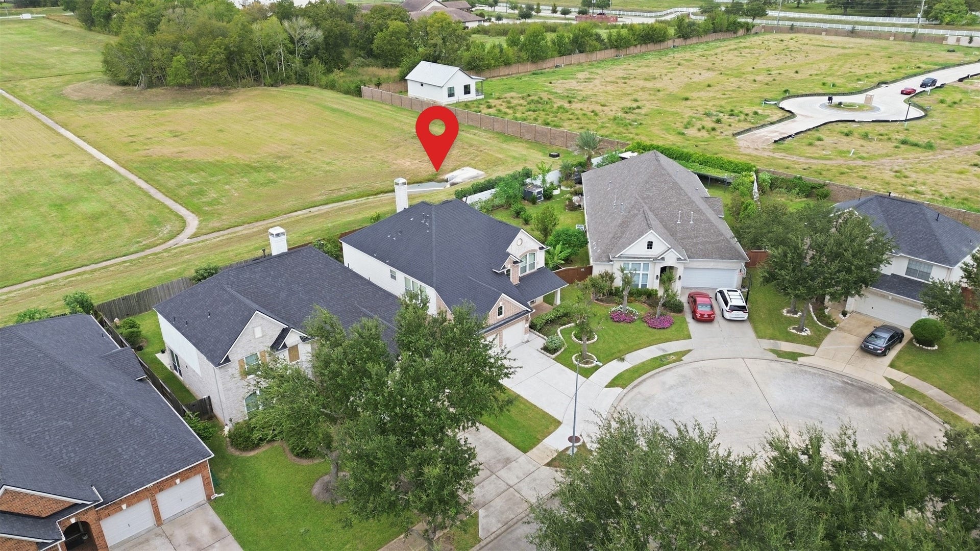 5106 Autumn Rose Lane, Sugar Land, TX 77479 The pin marks the home on its quiet cul-de-sac, with the open green space and walking path just beyond the back fence.