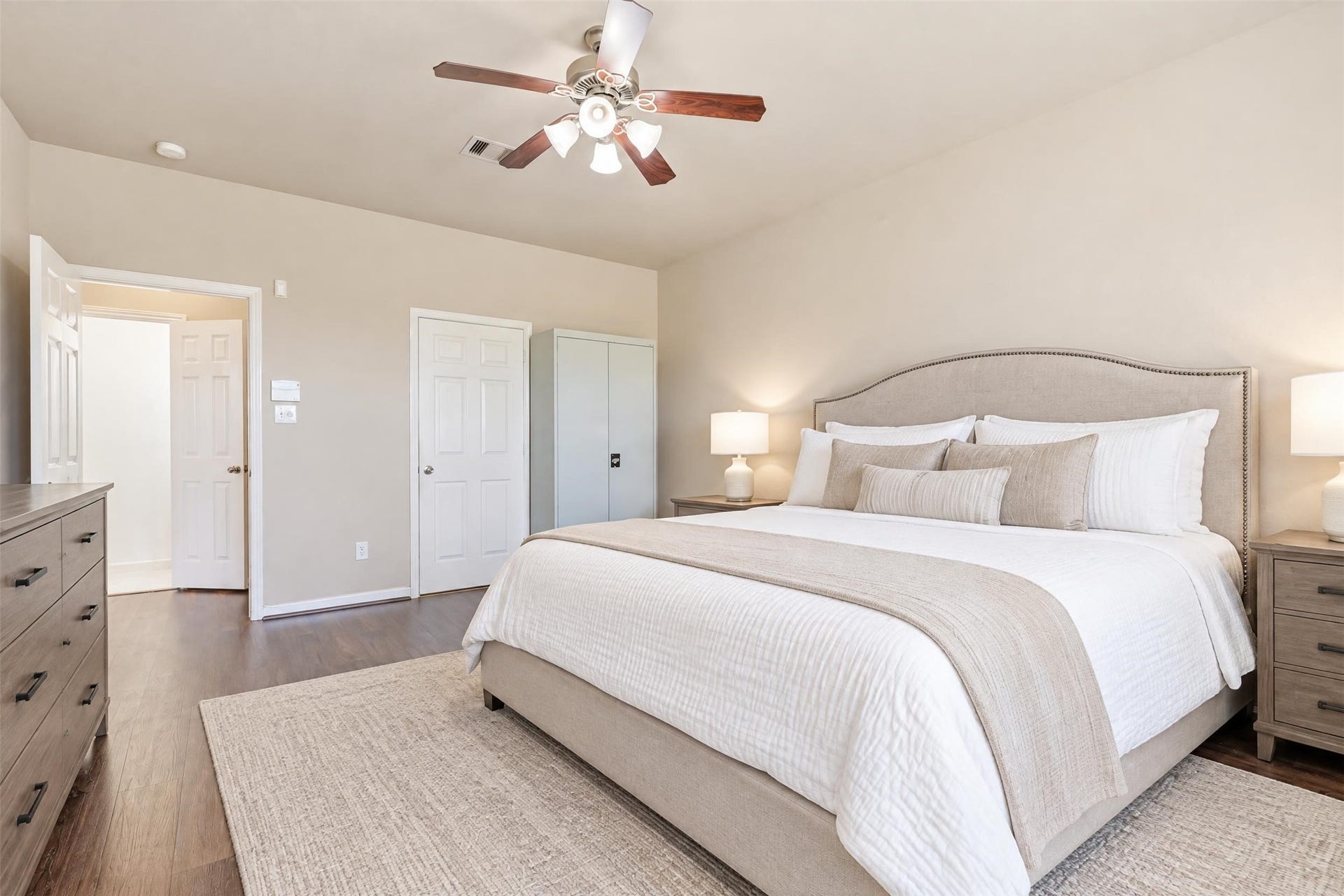 5106 Autumn Rose Lane, Sugar Land, TX 77479 Virtually staged. Large windows bring in soft natural light, and the main-level location means no stairs at the end of a long day.