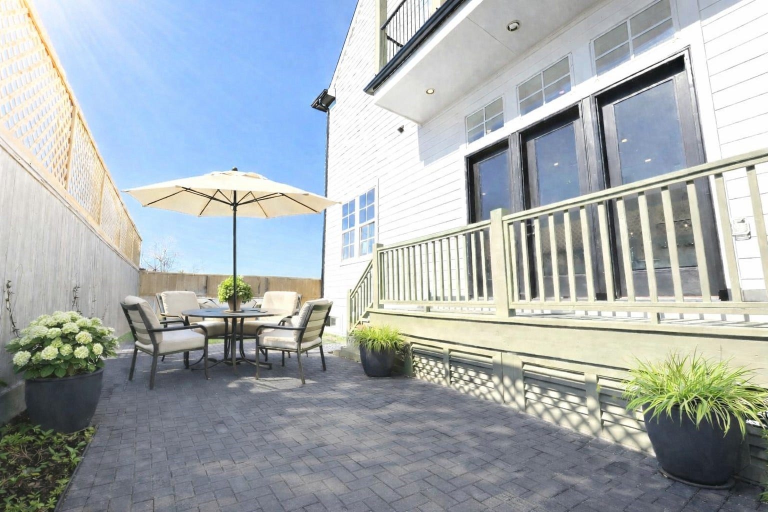 11061 Chatterton Drive, Houston, TX 77043 Spacious private back yard with deck. Virtual staging added.