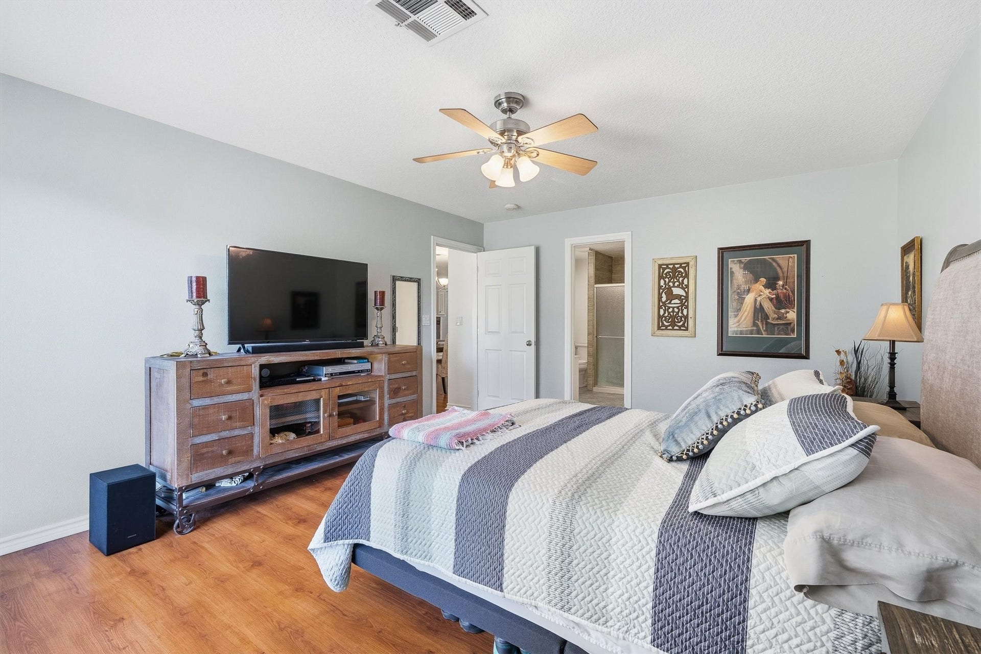 149 Thunderbird Drive, Conroe, TX 77304 Thanks to the split floor plan, the primary suite gets its own private wing, with the ensuite bath just through the door.