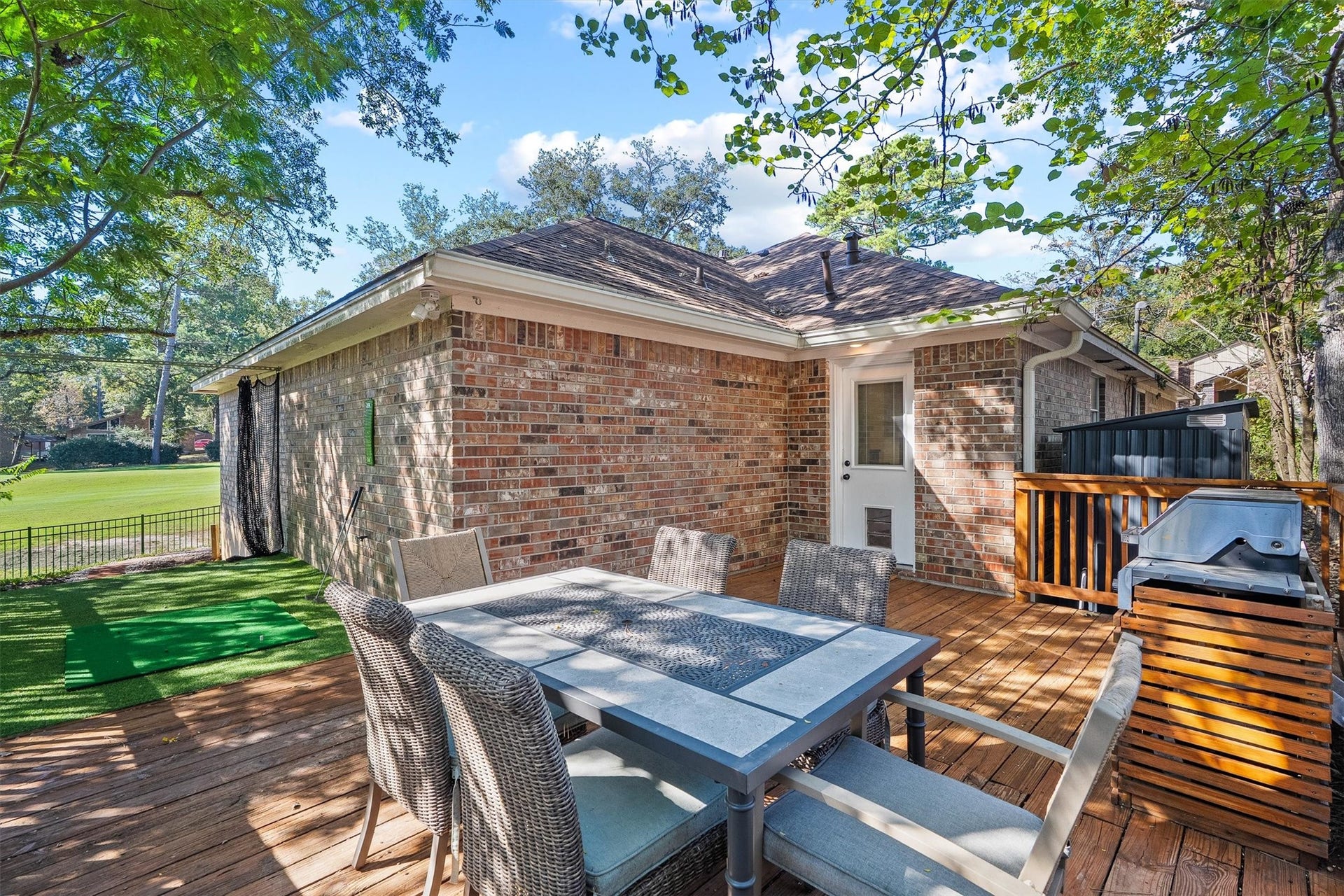 149 Thunderbird Drive, Conroe, TX 77304 Around the side, a spacious wood deck sits under mature shade trees, giving you a second outdoor living area for alfresco dinners.