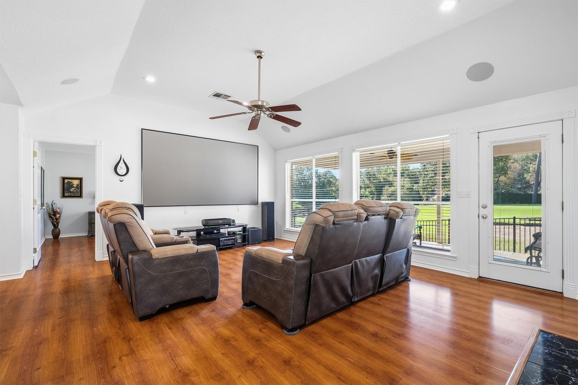 149 Thunderbird Drive, Conroe, TX 77304 At the heart of the home, the oversized windows pull in natural light all day long and keep the fairway in sight without ever leaving the couch.