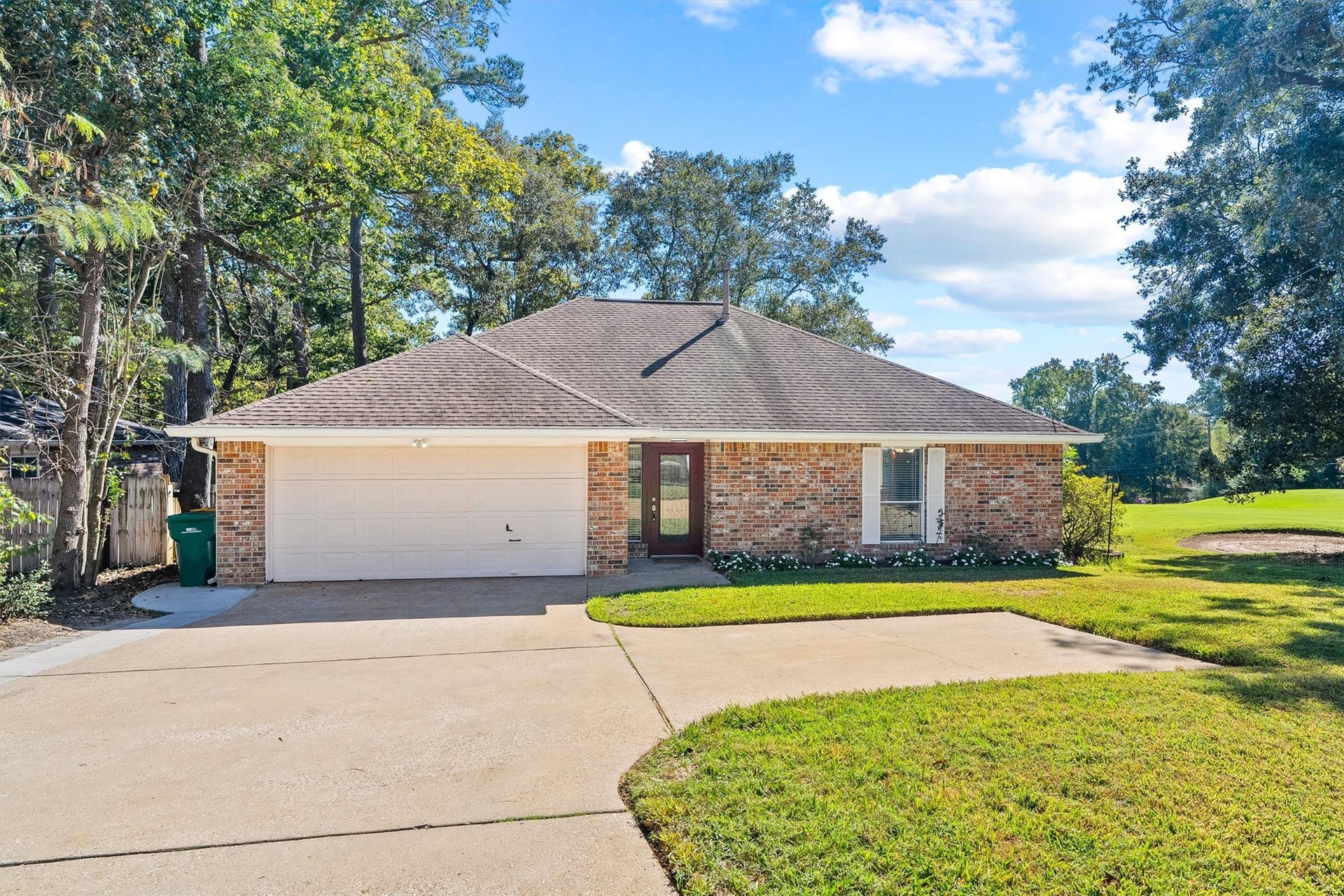 149 Thunderbird Drive, Conroe, TX 77304 The widened driveway makes room for cars, guests, and the occasional golf buddy, while the garage is sized as a golf cart garage, so your ride to the course stays tucked away. Lets head inside.