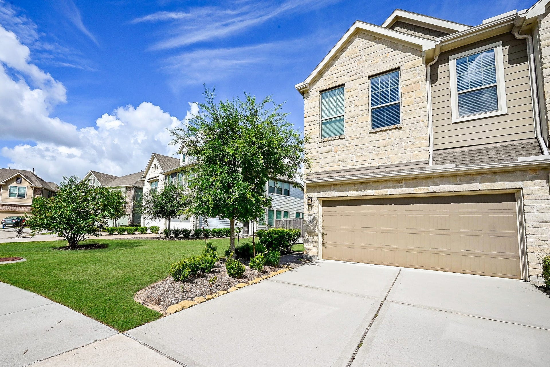 Charming stone elevation welcomes you home to this beautifully located townhome in Bridgeland!