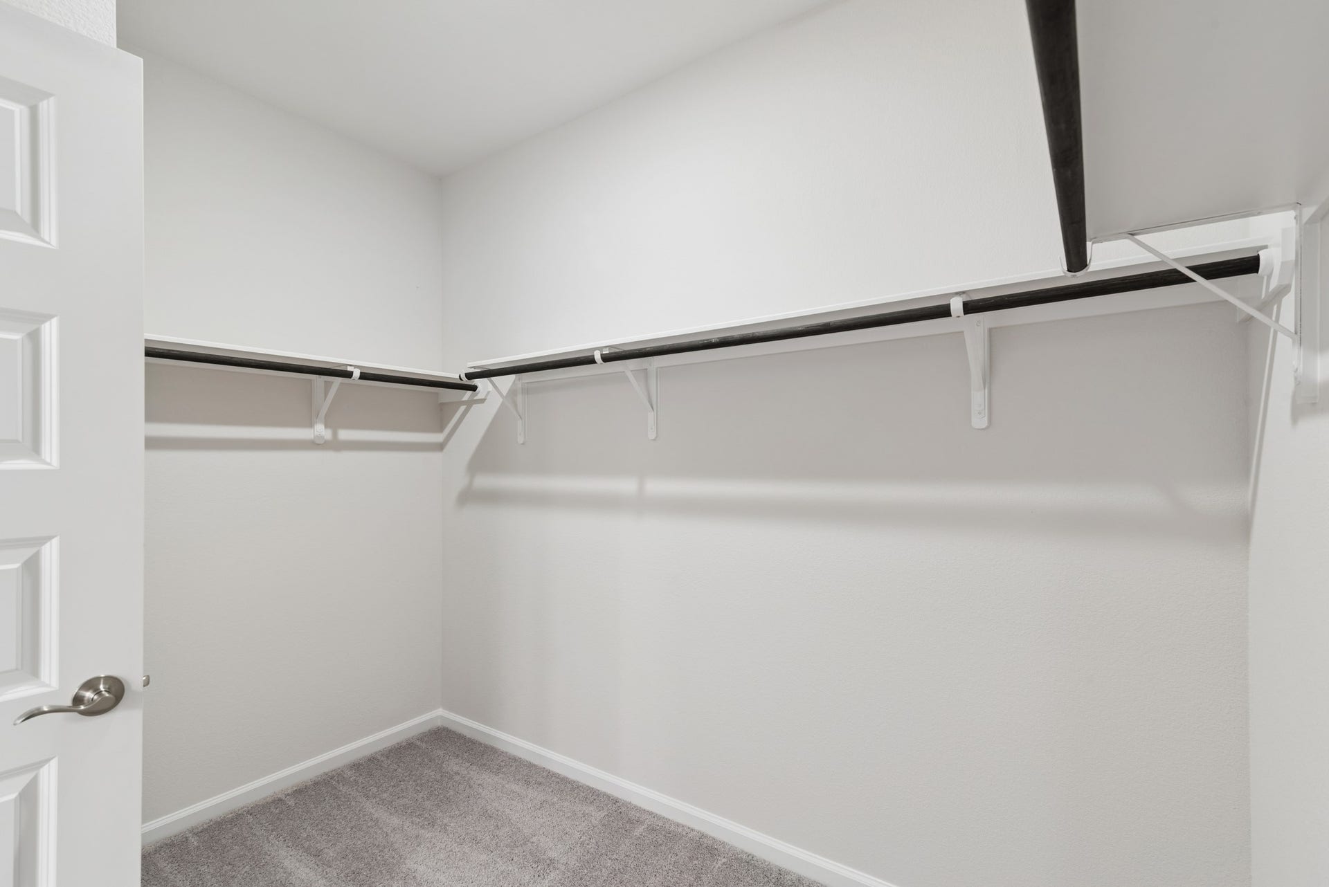 2523 Outpost Canyon Drive, Iowa Colony, TX 77583 The Oakshire II- Primary Bedroom Closet. Sample image for illustration; upgrades, options, and colors may vary.