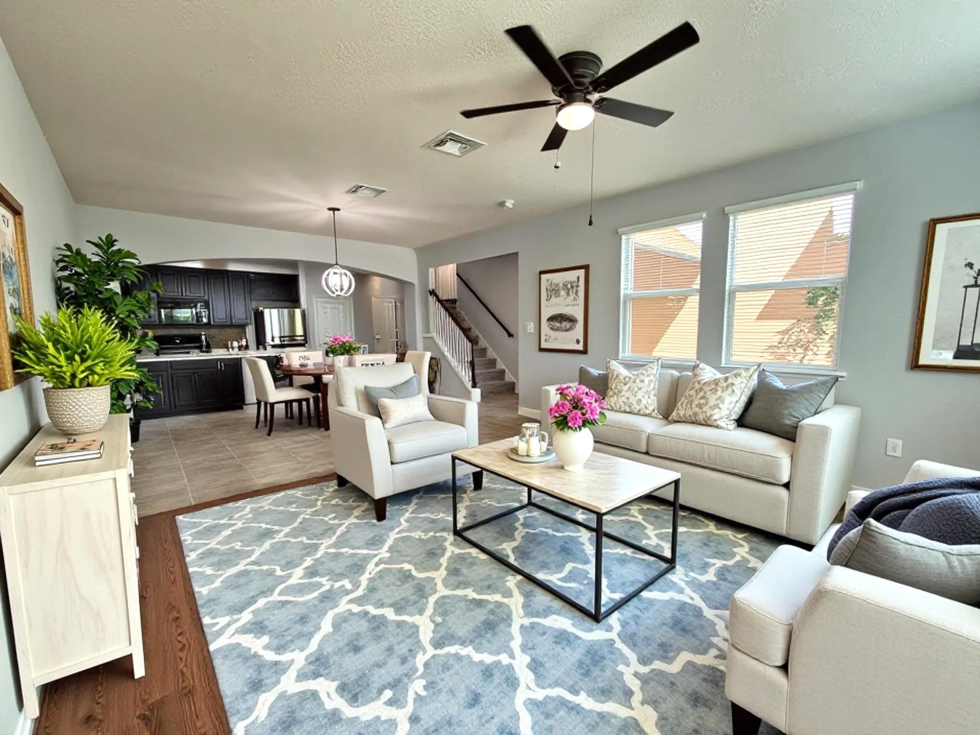 8415 Sunset Loch Drive, Spring, TX 77379 Large living room with new flooring and lots of windows for natural light.