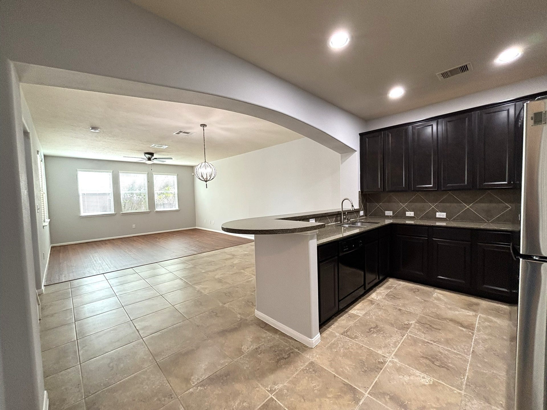8415 Sunset Loch Drive, Spring, TX 77379 Open kitchen design to breakfast and living room.