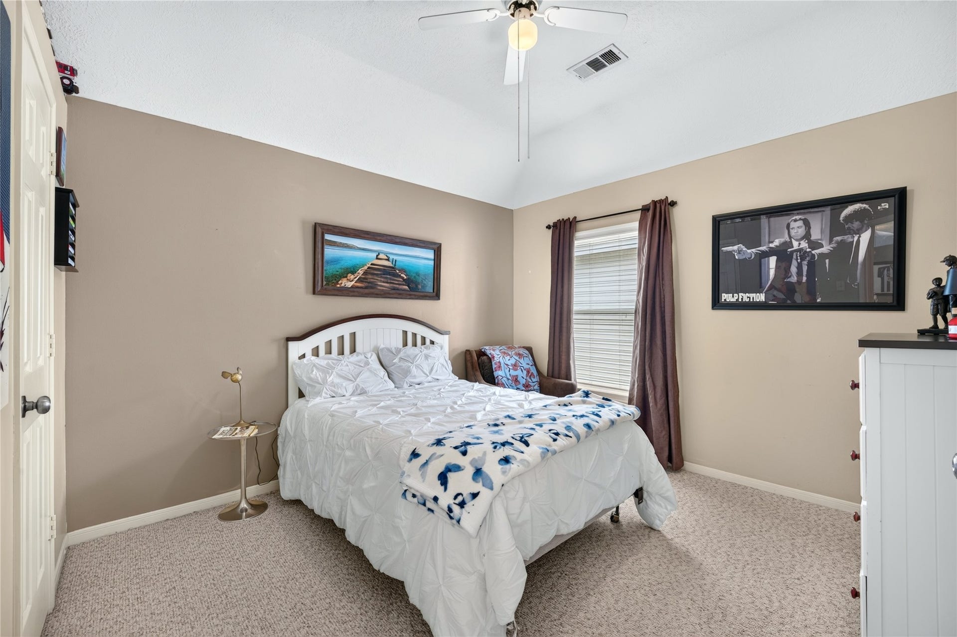 Third bedroom with vaulted ceiling and ample space.