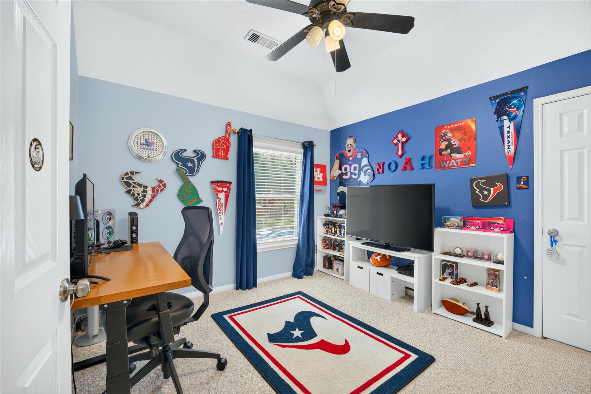 Versatile fourth bedroom or home office with vaulted ceiling.