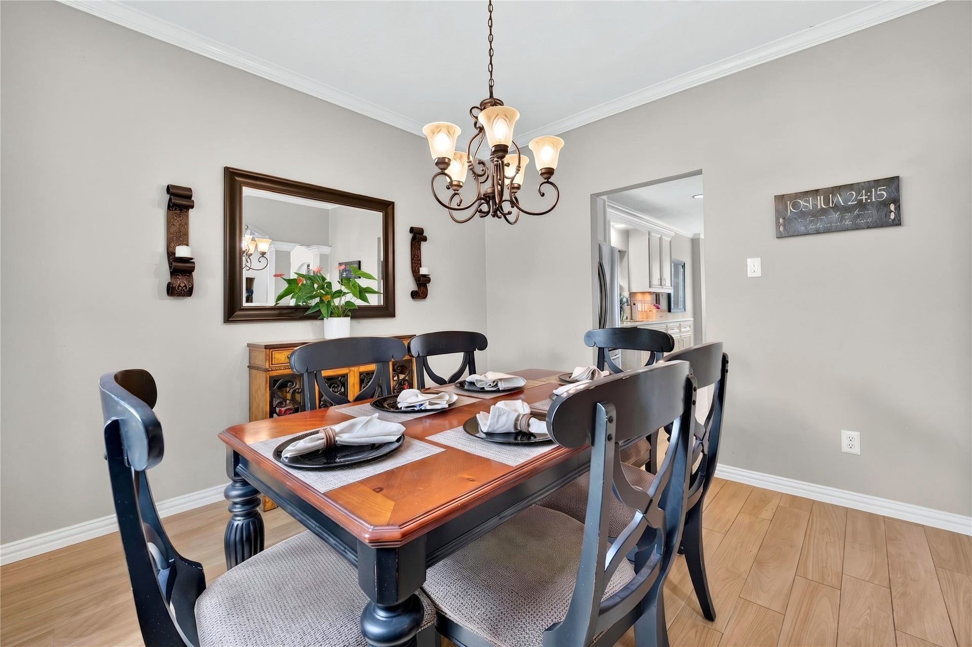 Elegant formal dining room with crown molding, beautiful chandelier and easy access to the kitchen.