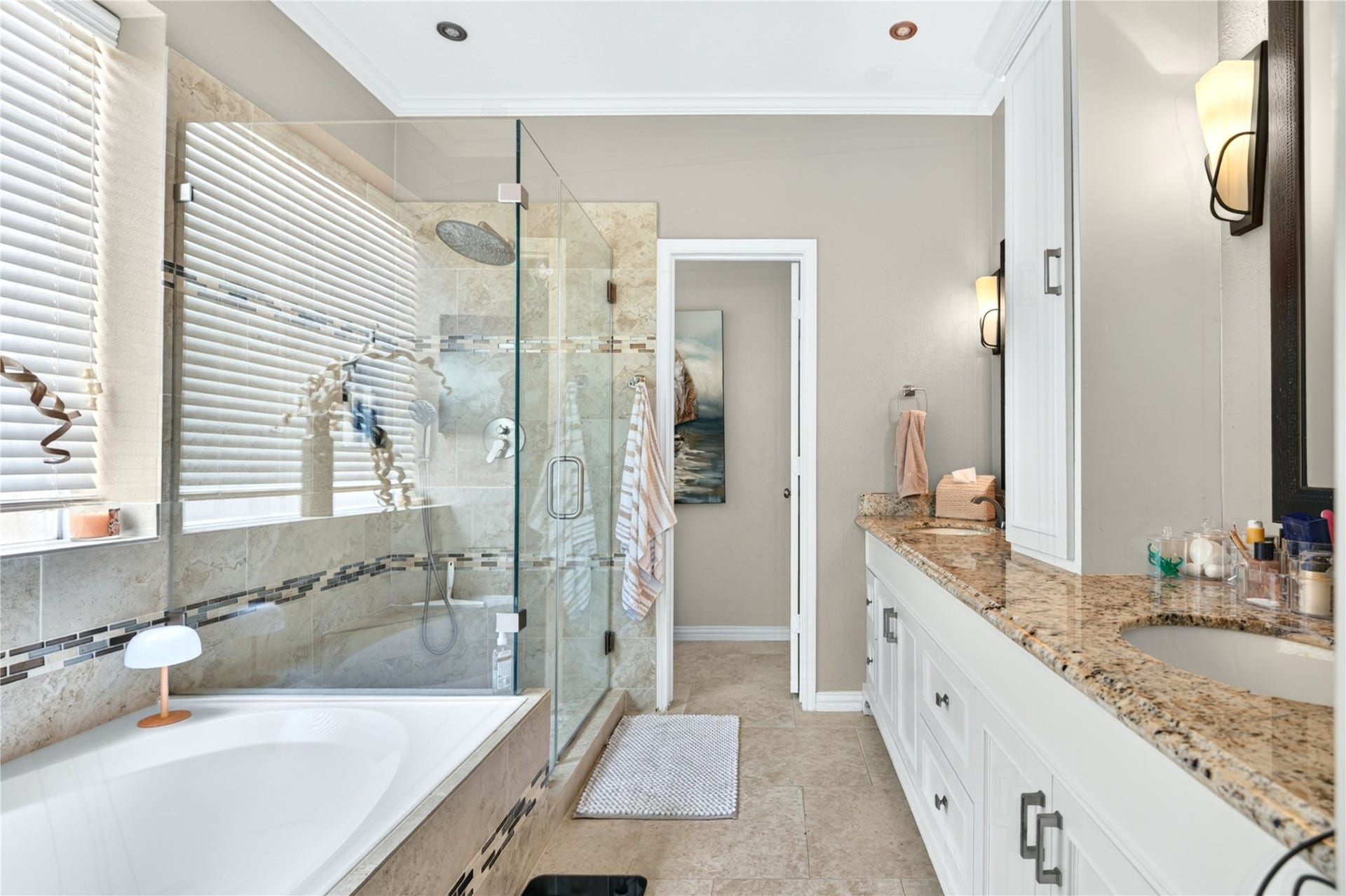 Primary bath featuring soaking tub, separate walk-in shower and extended vanity.