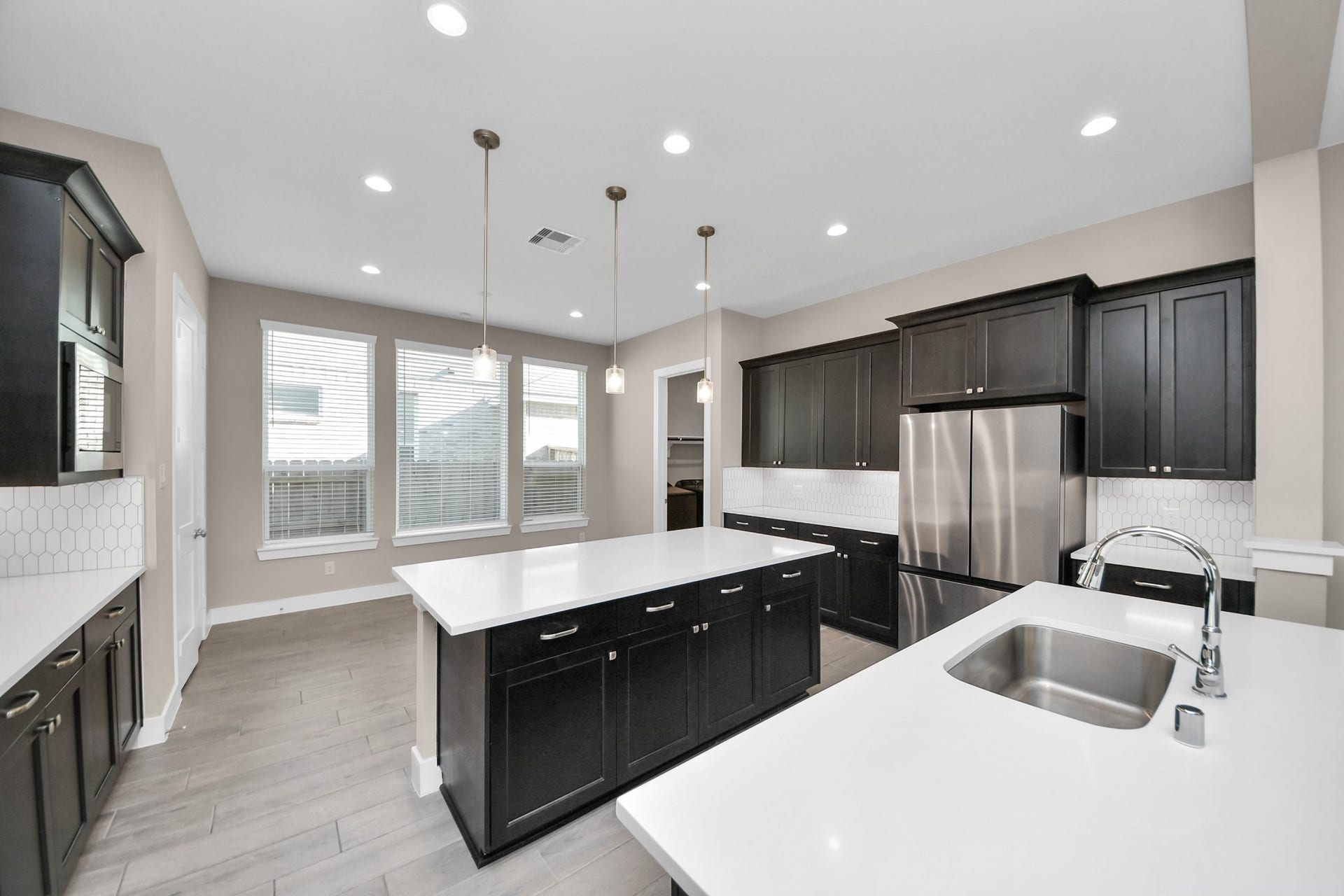 Kitchen with breakfast area behind it