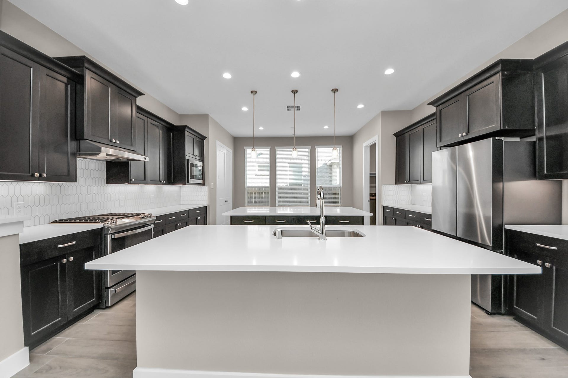 Open concept kitchen with dual islands