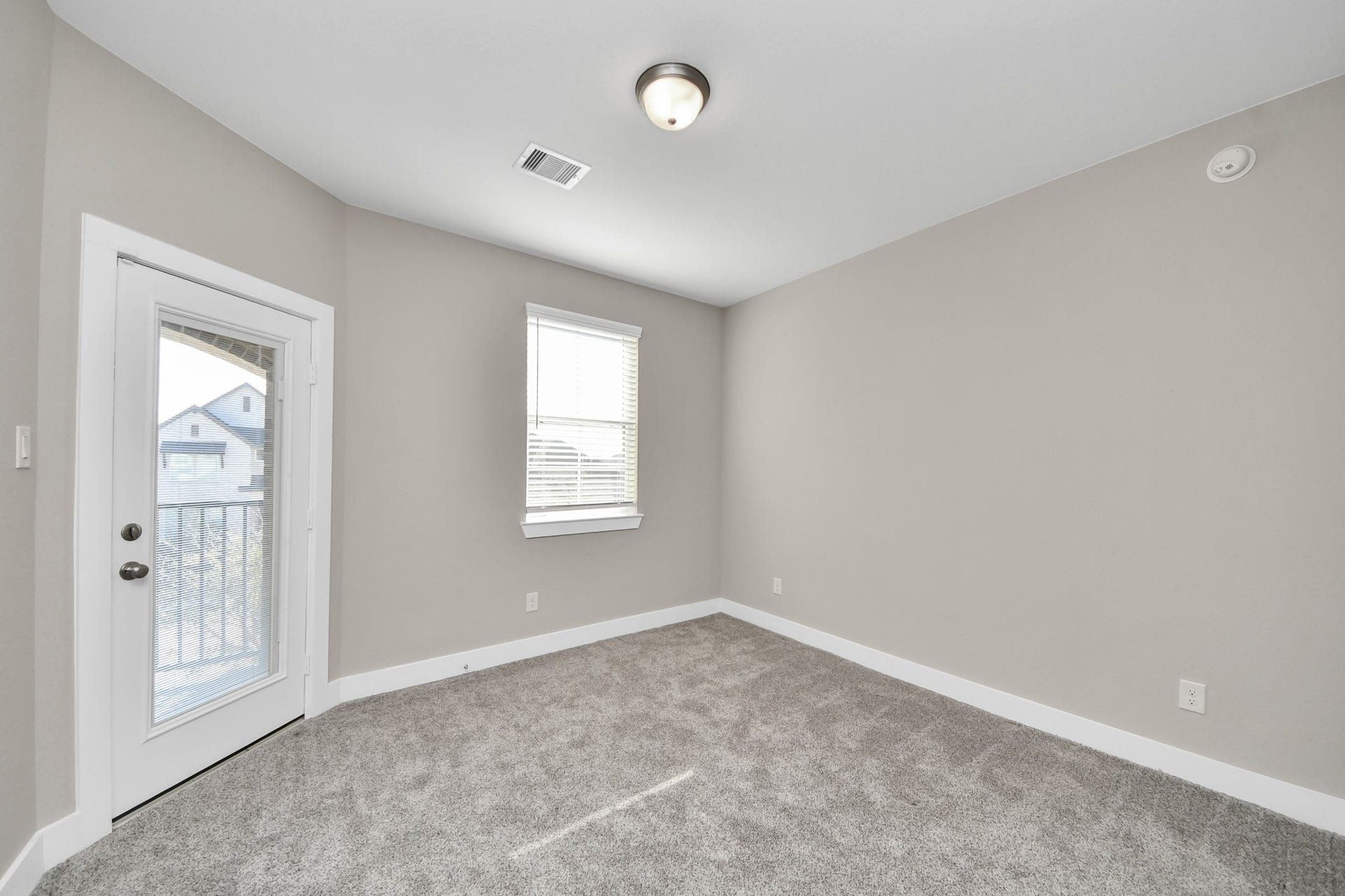 Upstairs secondary bedroom with balcony