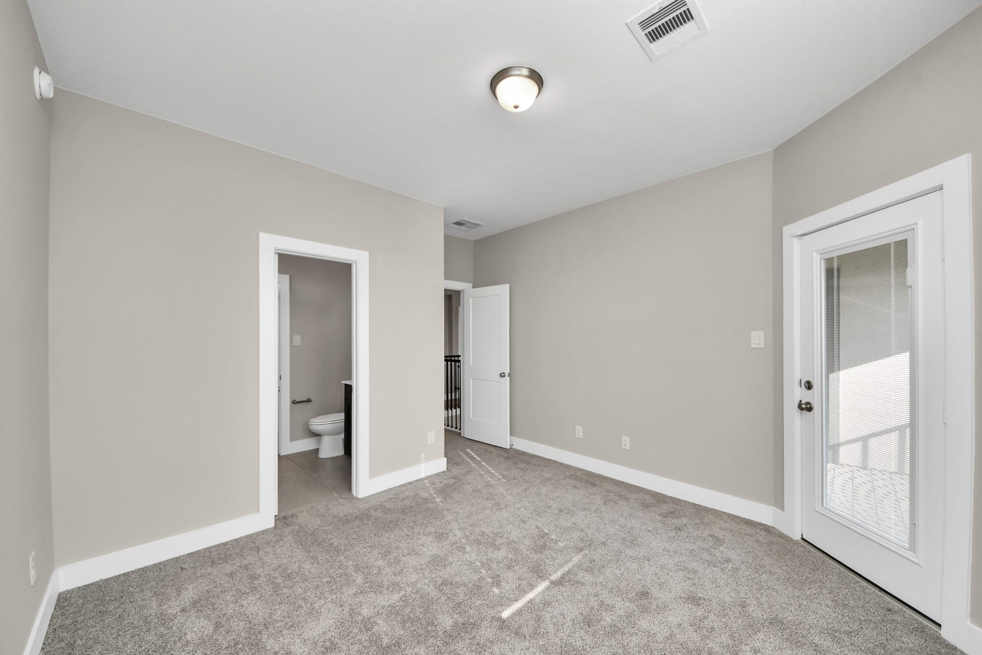 Upstairs secondary bedroom with balcony
