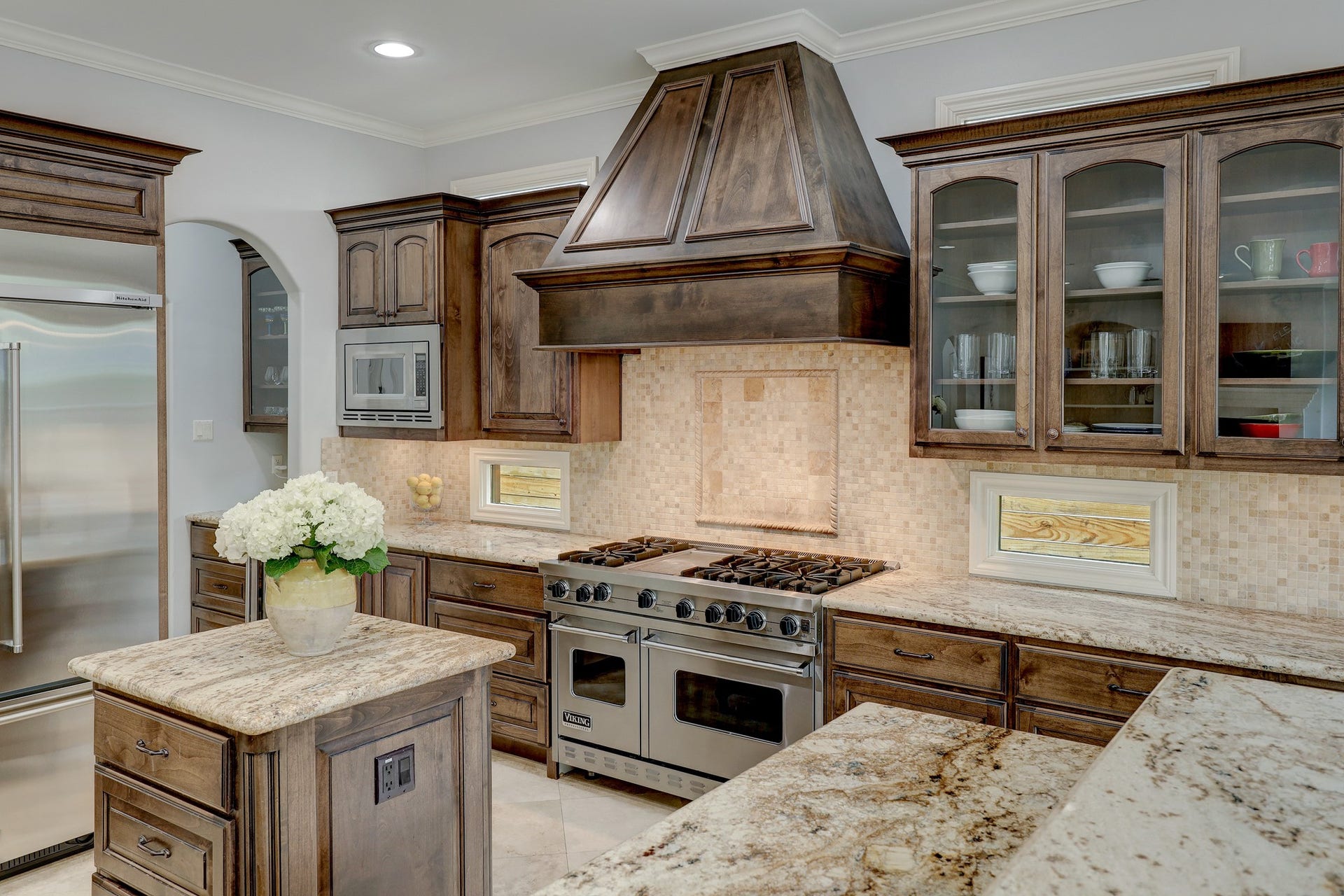 6004 Lake Street, Houston, TX 77005 Cook's delight kitchen with rich wooden cabinetry, stainless steel appliances, and spacious countertops, perfect for culinary enthusiasts.