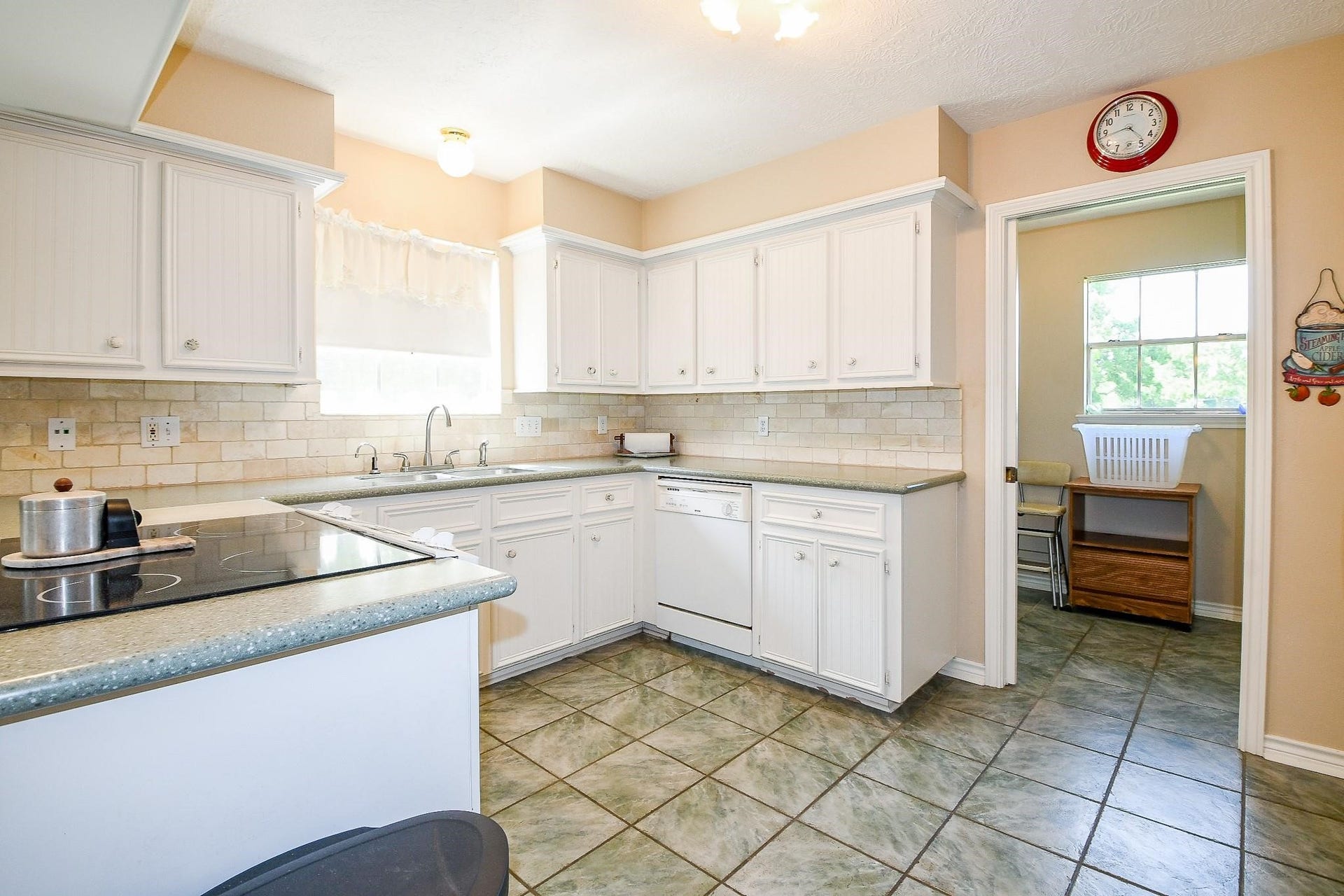 22035 Buescher Road, Tomball, TX 77377 Large kitchen in the primary house with solid counters and white cabinets