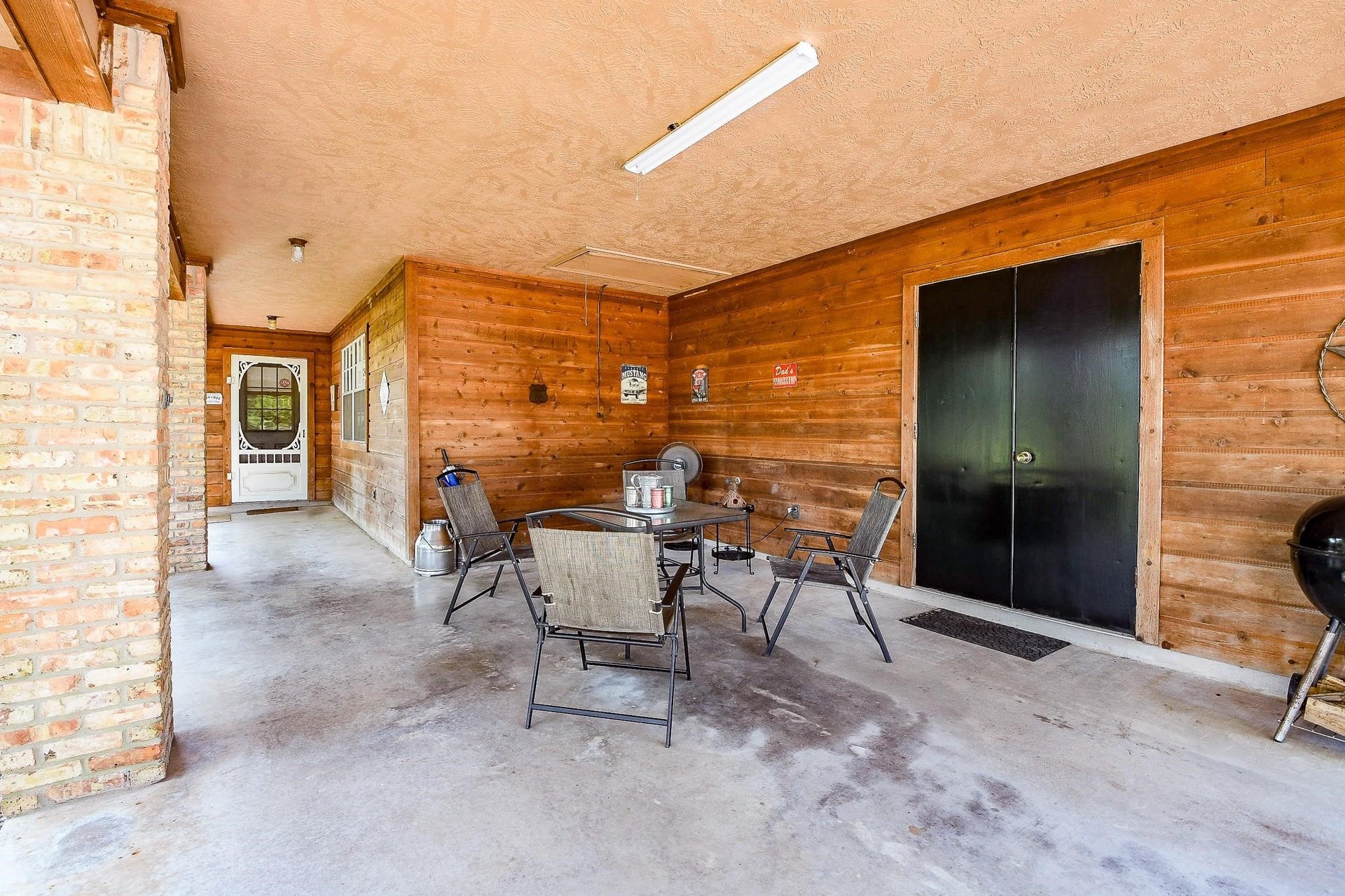 22035 Buescher Road, Tomball, TX 77377 Immense covered porch in the secondary house with a storage closet