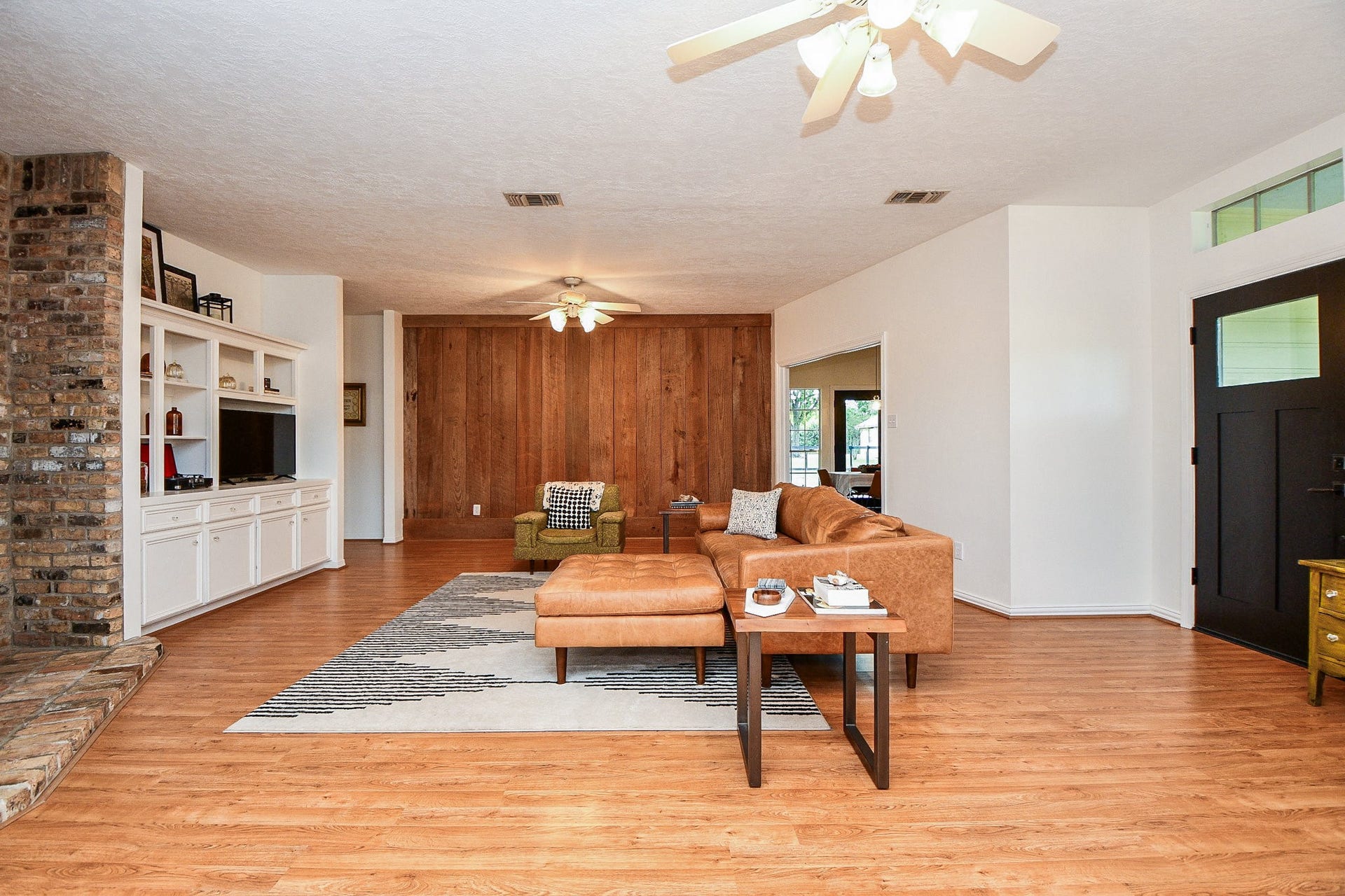 22035 Buescher Road, Tomball, TX 77377 Primary house living room features a gorgeous reclaimed barn wood feature wall