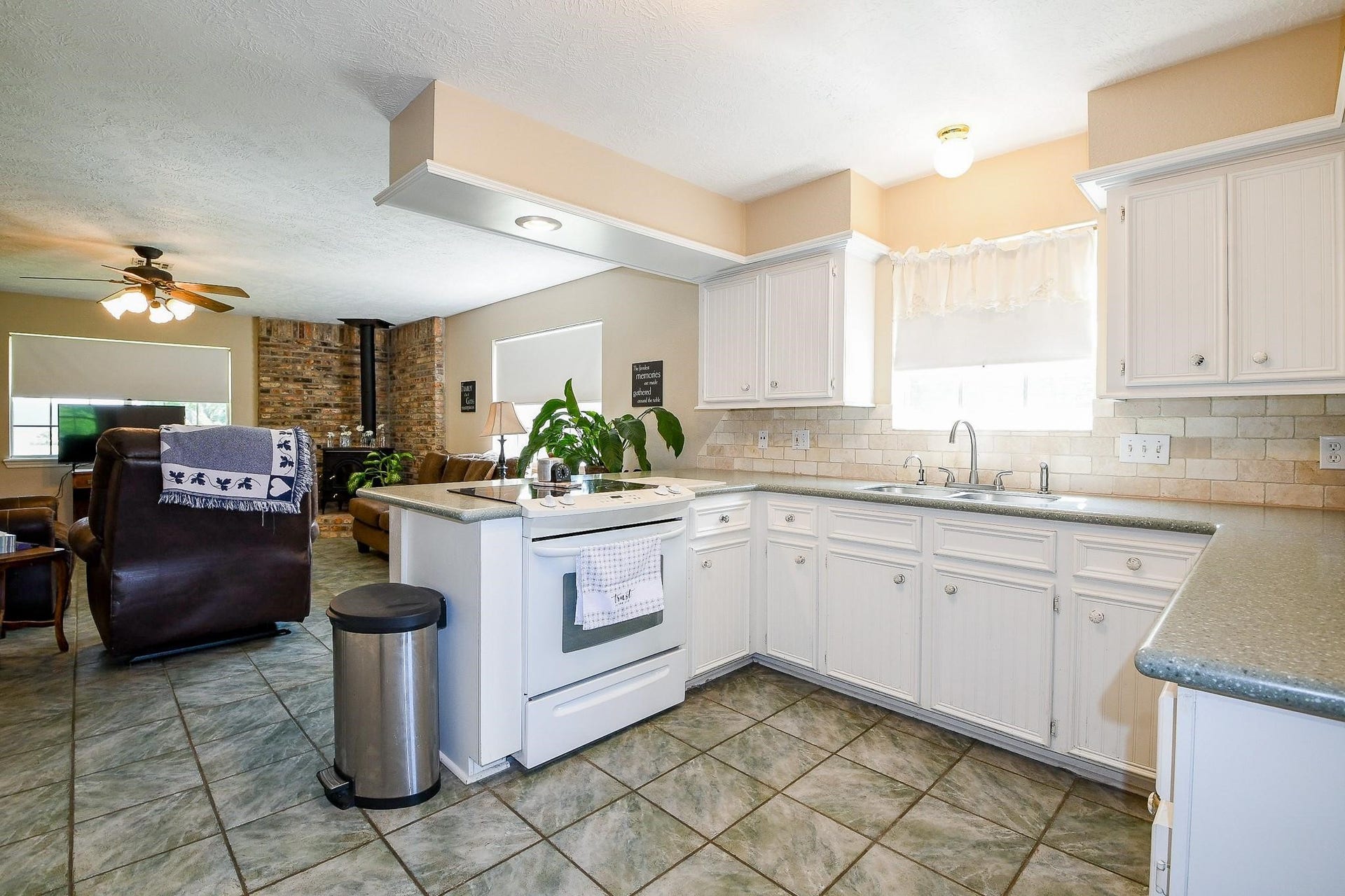 22035 Buescher Road, Tomball, TX 77377 Large kitchen in the primary house with solid counters and white cabinets
