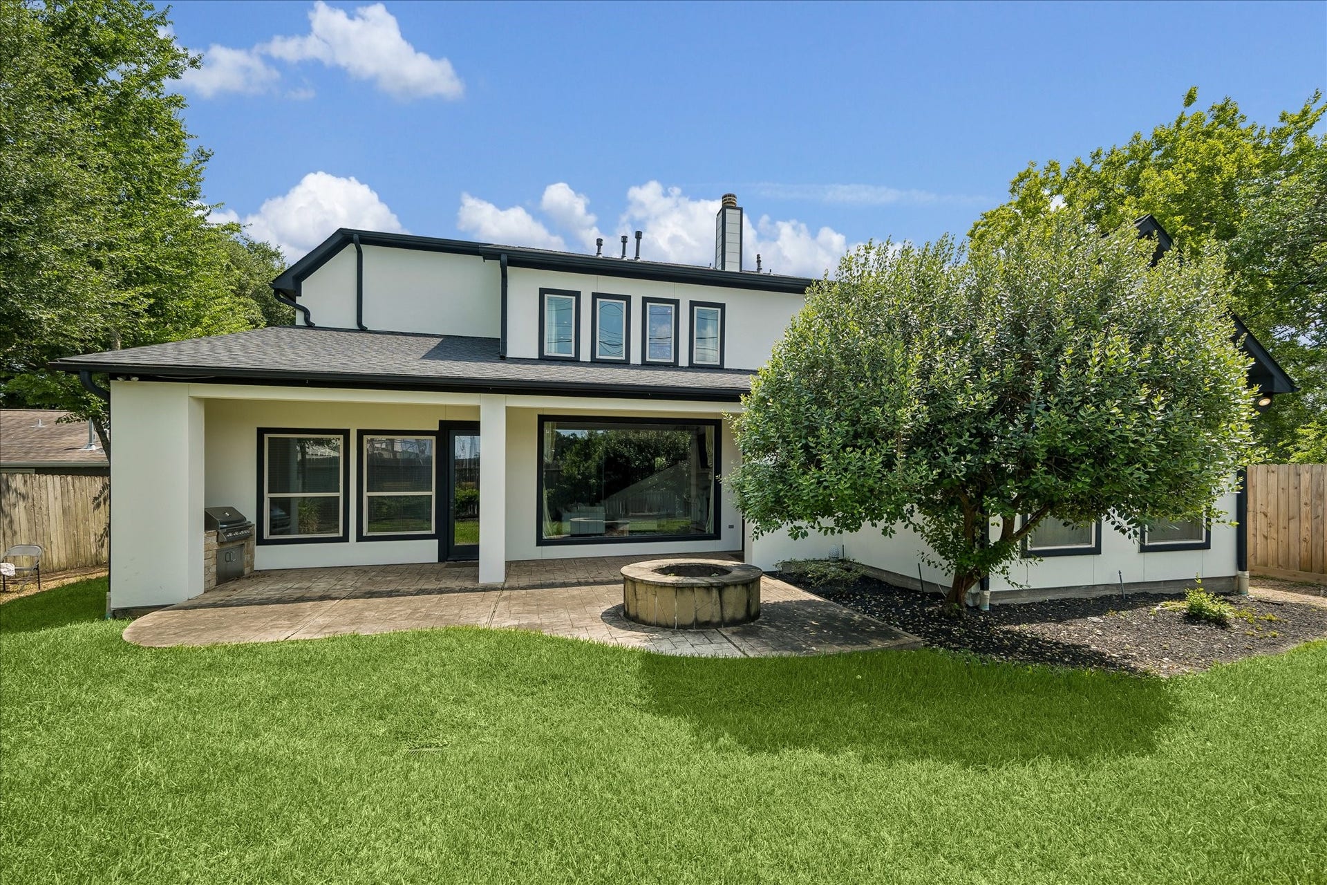 4802 Saxon Street, Bellaire, TX 77401 Create your own outdoor escape. Here we have a covered patio, outdoor kitchen, and spacious backyard.