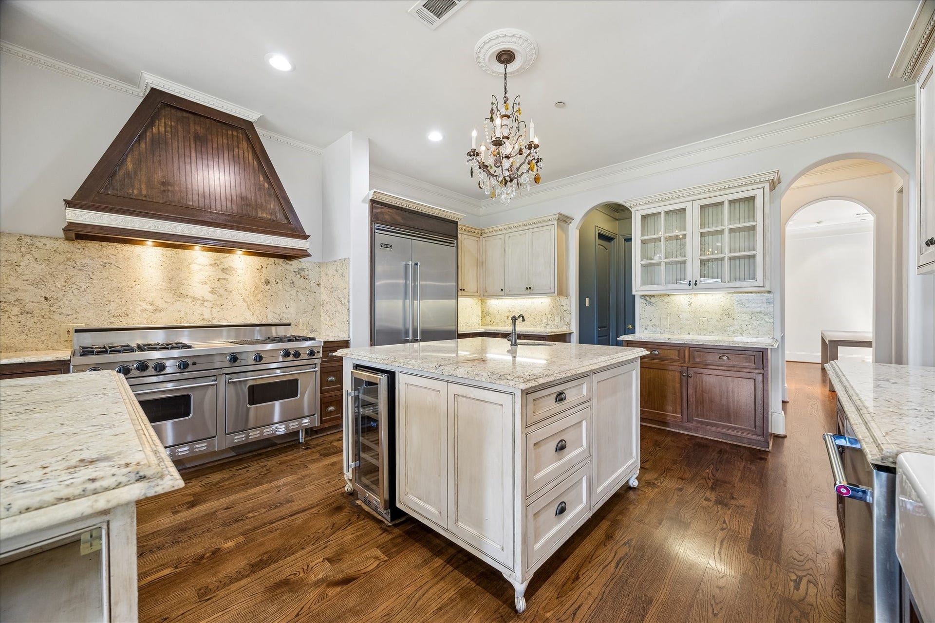 4802 Saxon Street, Bellaire, TX 77401 The oversized chefs kitchen offers two large islands, built-in refrigerator, prep sink, two dishwashers, double ovens, Viking range, separate ice maker, wine refrigerator, and a kegerator in the butlers pantry.